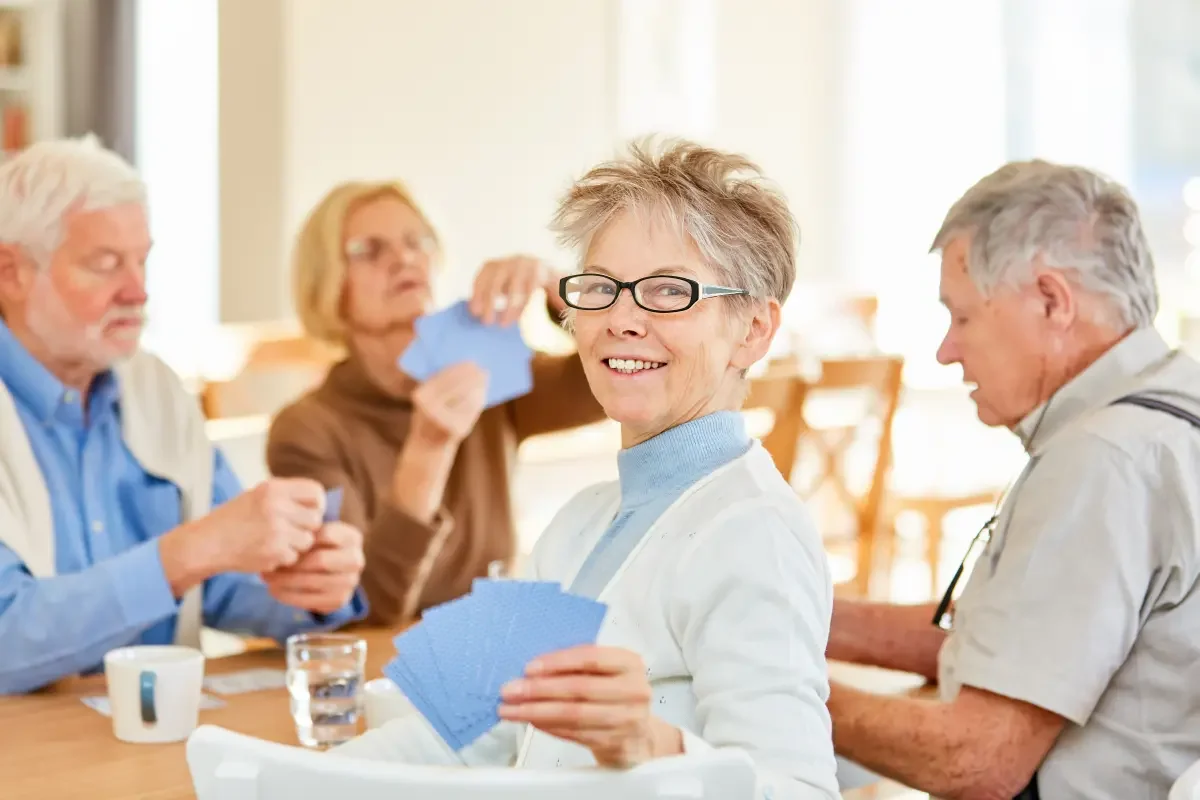 Residents enjoying a card game activity.