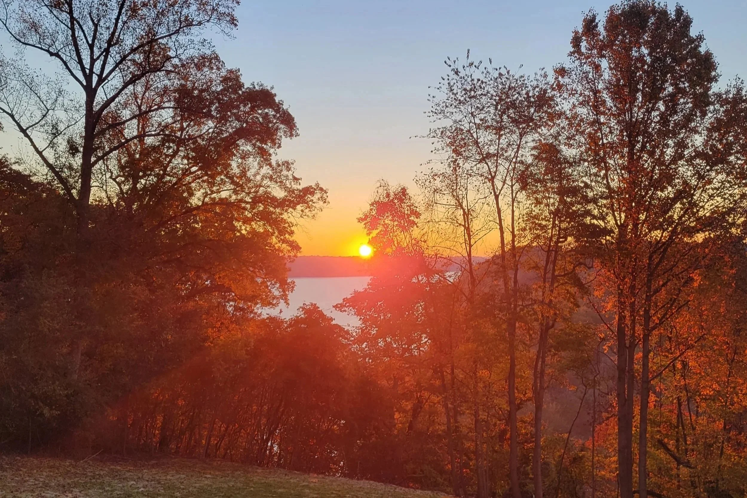Peaceful sunset over the Susquehanna River, showcasing the serene location of Broad Creek Manor Assisted Living in Harford County.