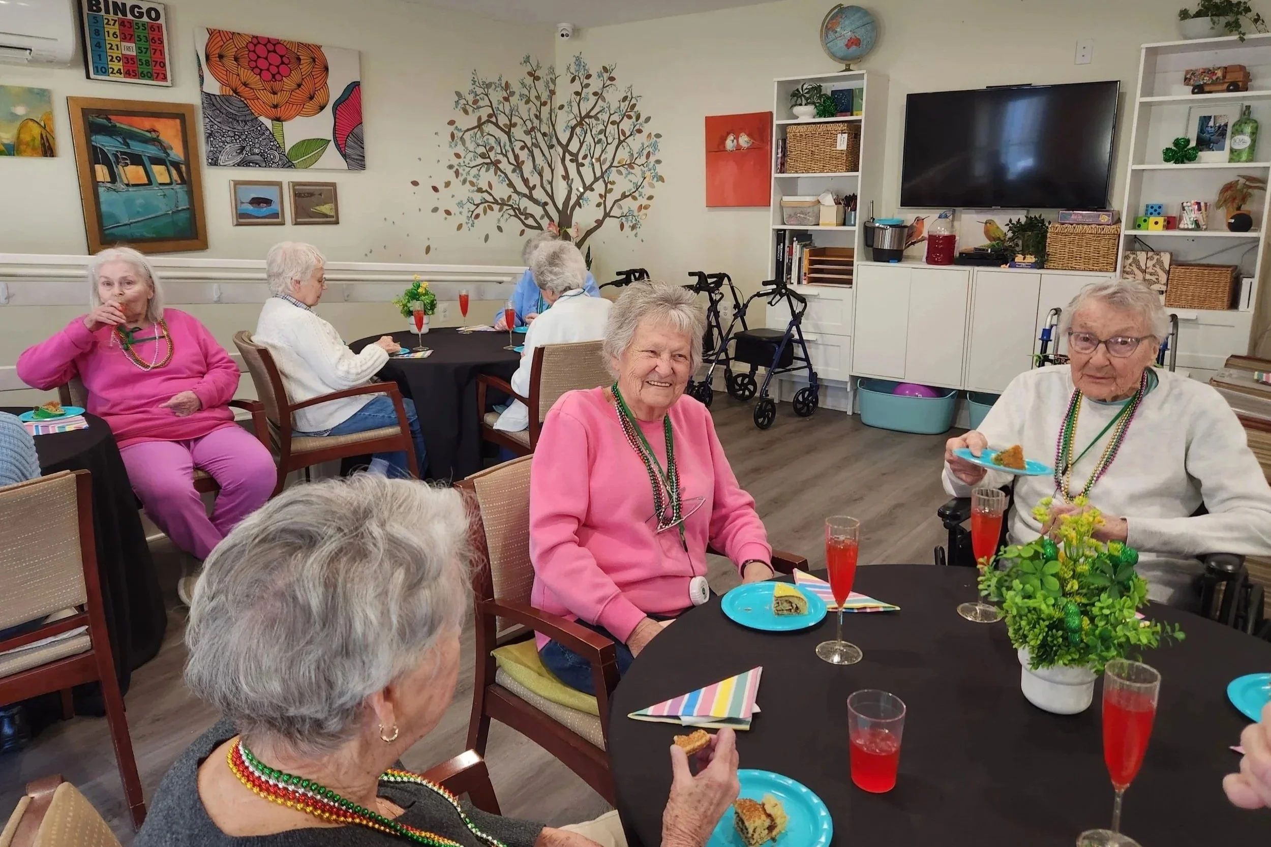 Residents at Broad Creek Manor Assisted Living in Harford County enjoying refreshments and conversation during a social activity.