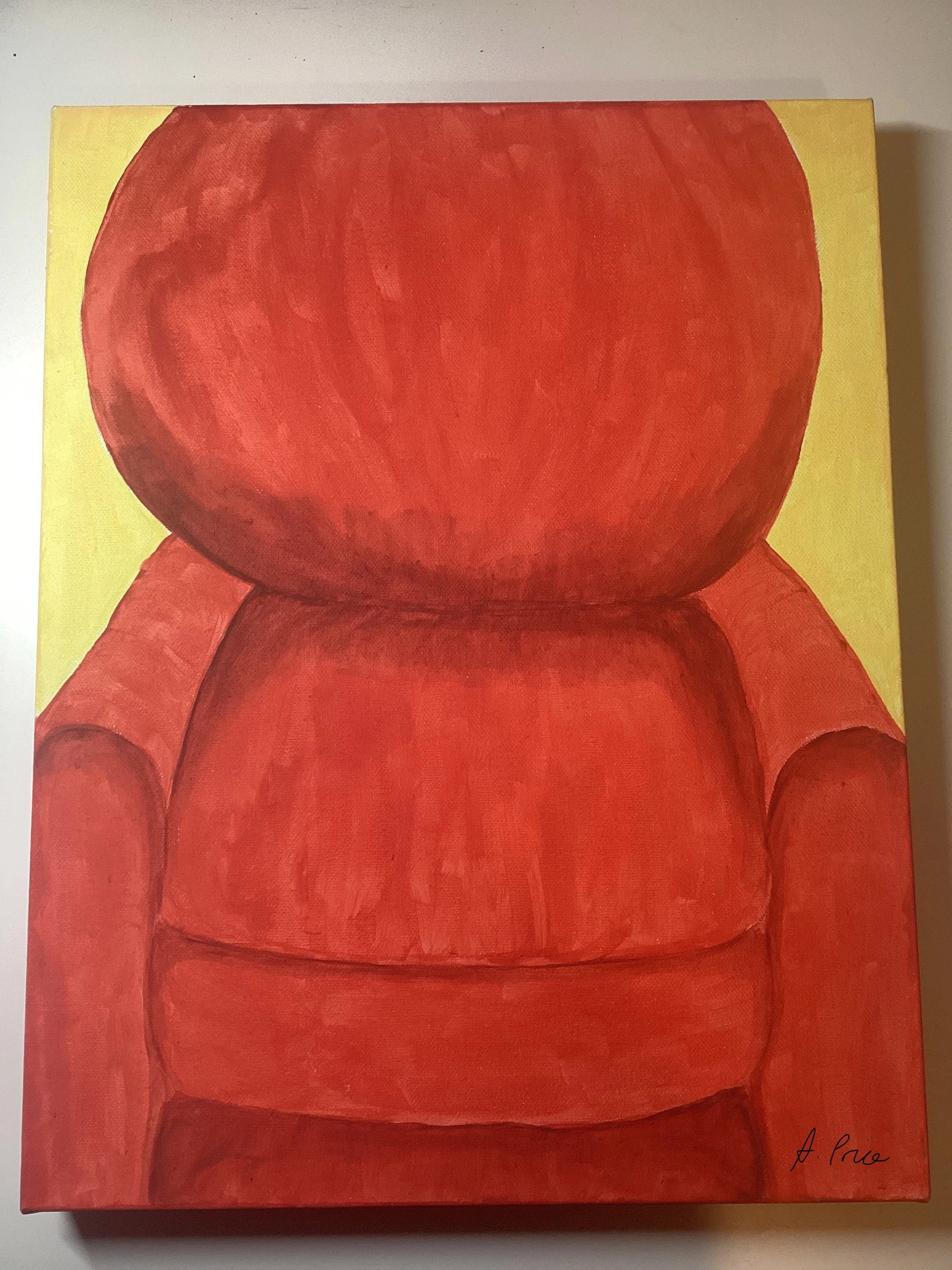 a painting of a red armchair with a rounded back fills most of the space, with a little of a yellow background behind.