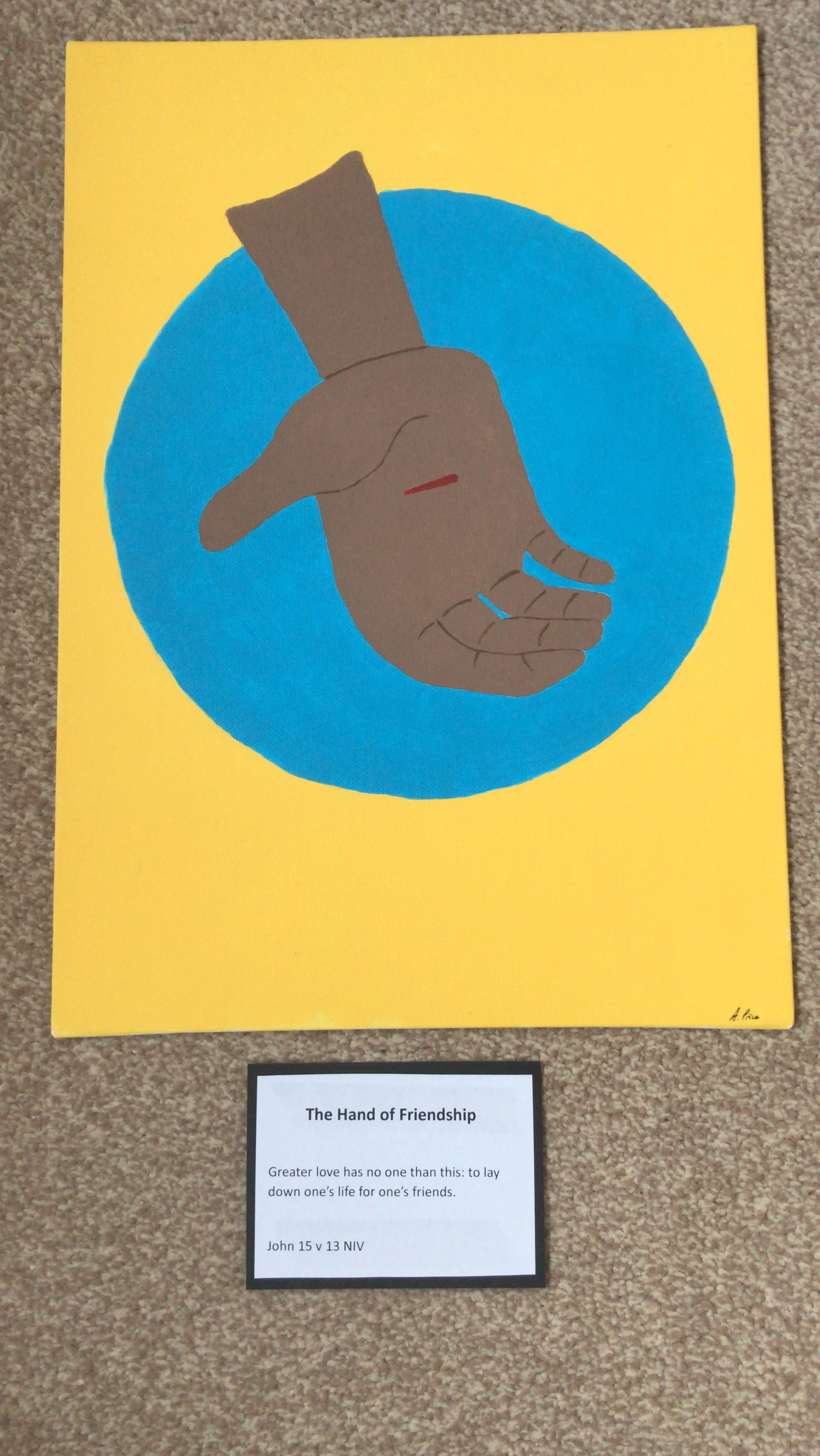 A blue circle on a yellow background, with the image of an open hand on the blue circle. The hand has a red line in the centre, representing a wound.
