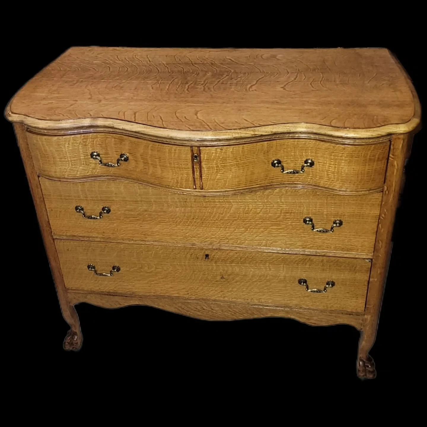 My daughter inherited this dresser, which was her grandmother's, and through its life and other hands, it was painted several times. After patience and vision, this beautiful tiger wood dresser has been reborn. I upgraded drawer sliders and fashioned