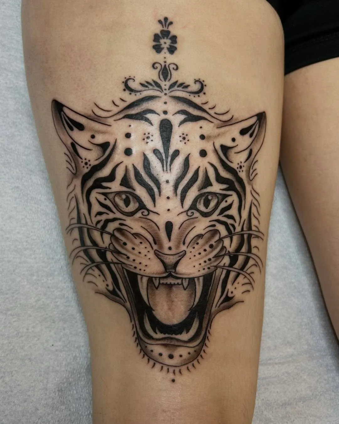 I dunno who&rsquo;s tougher - the tiger or the babe that got it on the back of her thigh 🫡  by Ellie.