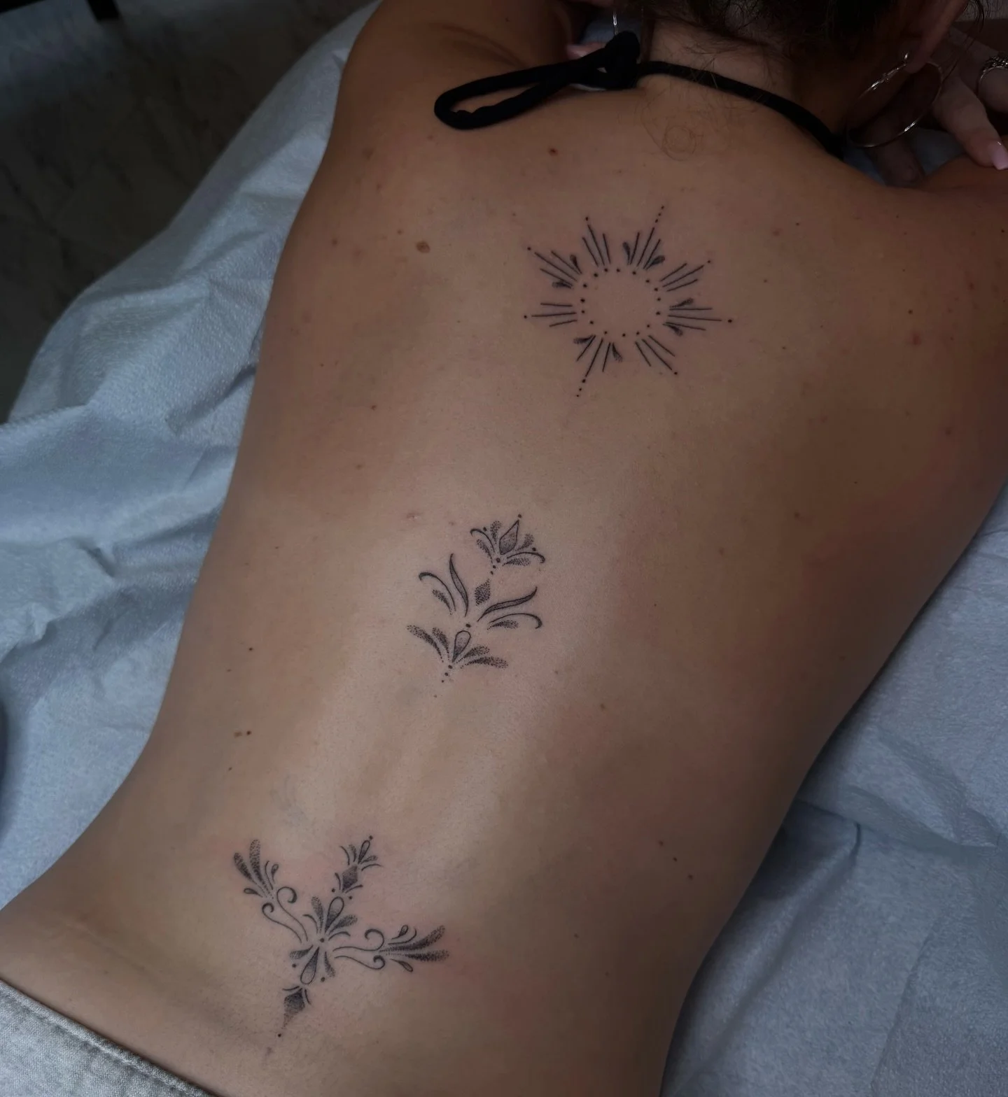 Spine ornaments by @elliemac.tattoos