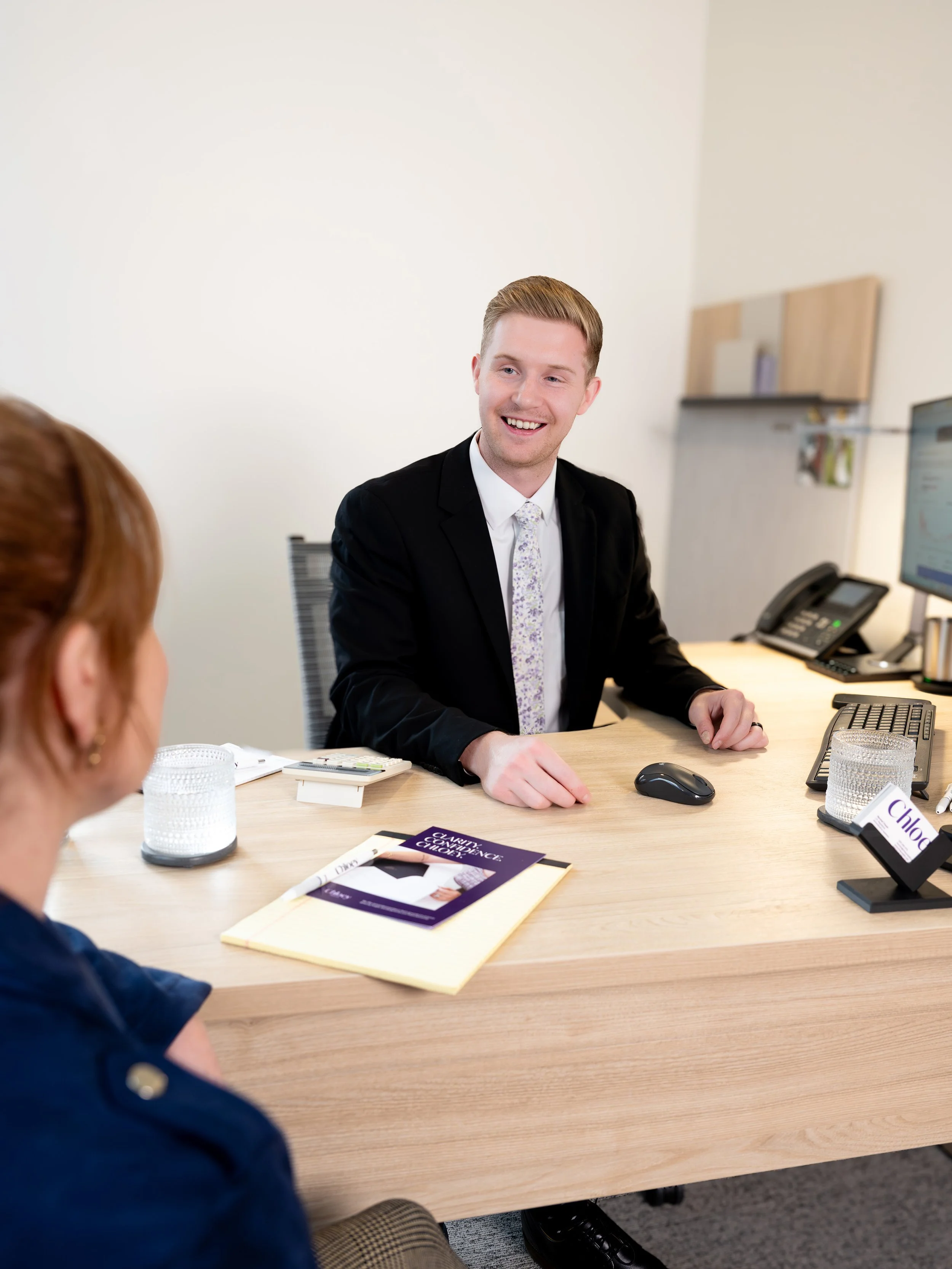 Financial planner talking with female client about retirement