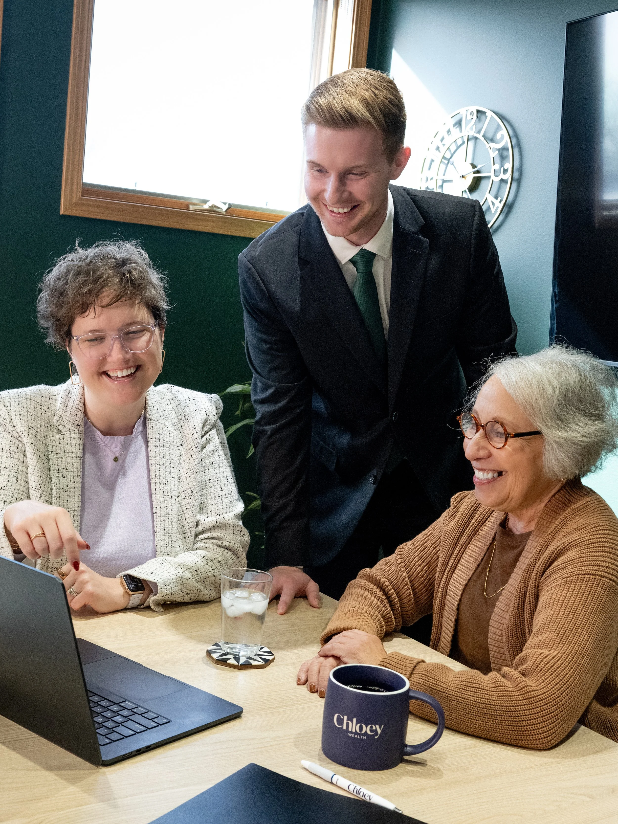 Female and male financial advisor strategizing with female client