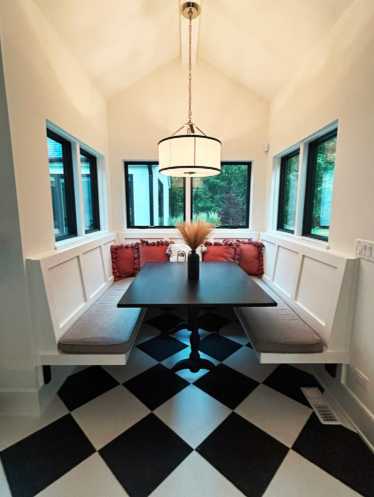 Cozy breakfast nook designed by ROHO Living Interior Design Company in Wayne, Illinois featuring diagonally placed checkered tile.