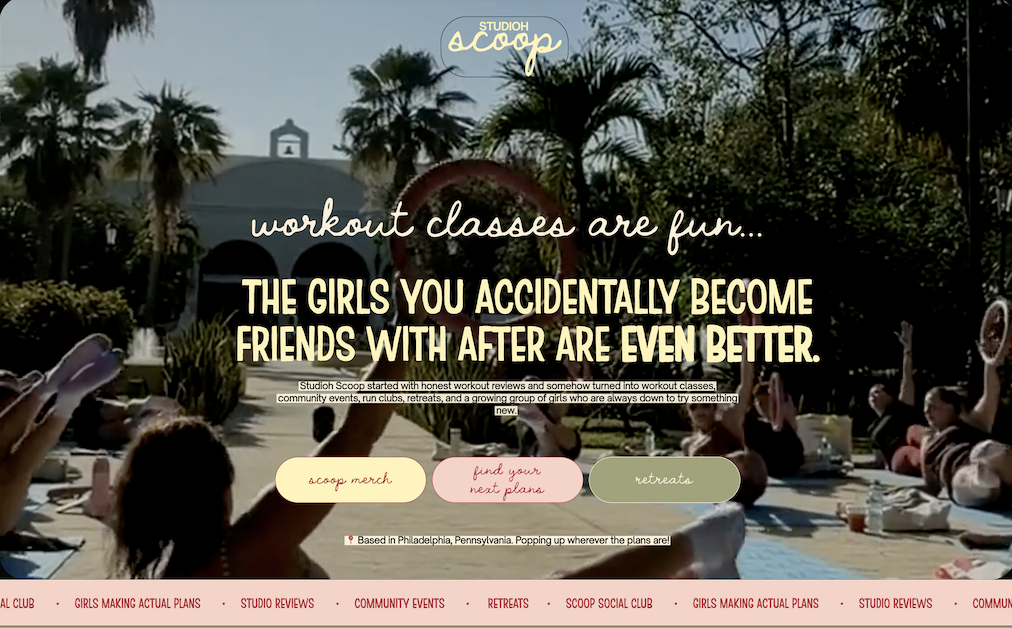 A group of girls at an outdoor fitness class in a garden with palm trees, participating in a workout session on a sunny day.