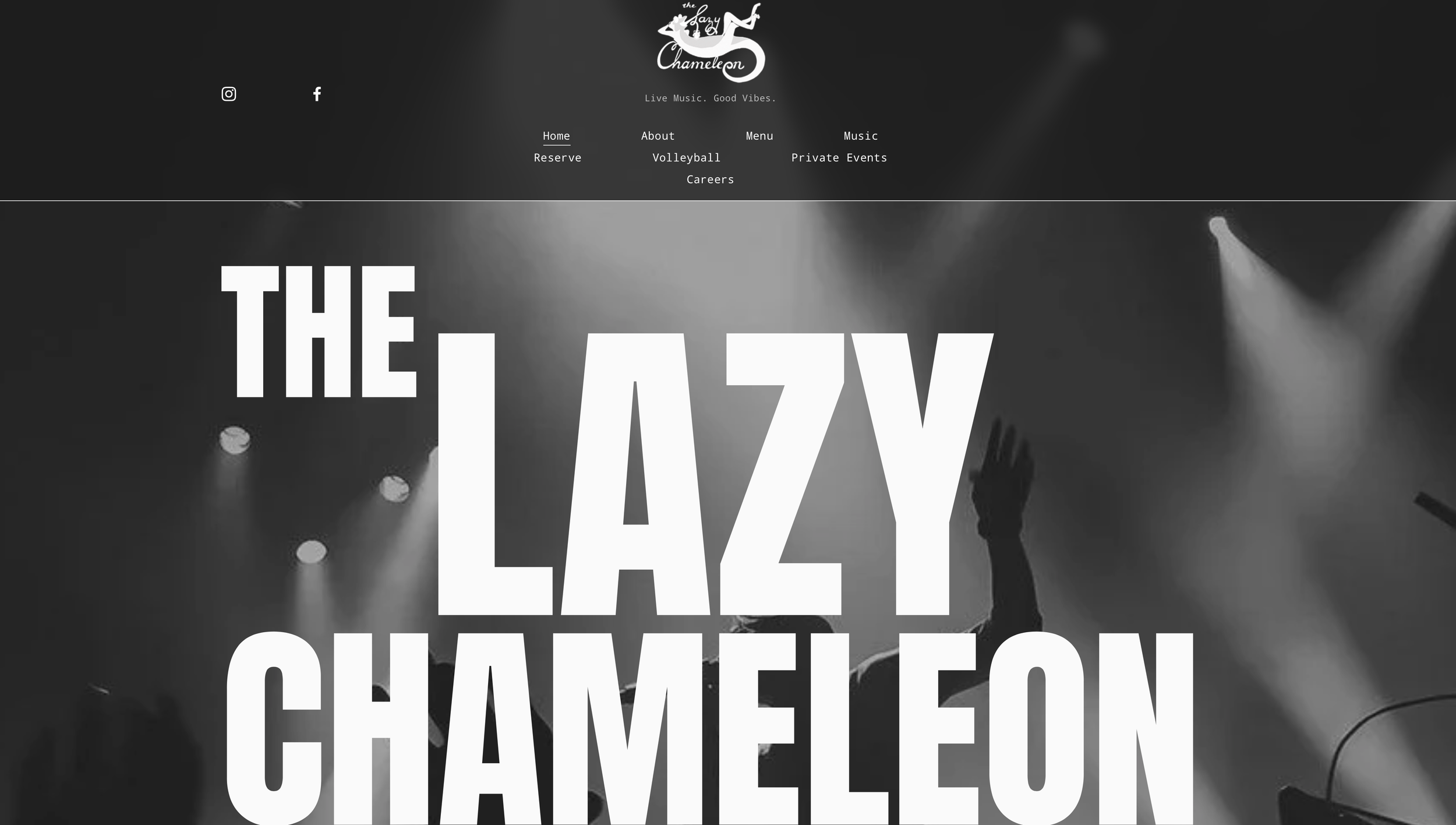 A website homepage for a venue called 'The Lazy Chameleon' featuring live music with a black and white background image of a concert stage with spotlights and an audience silhouette. The headline text reads 'THE LAZY CHAMELEON' in bold, large font.