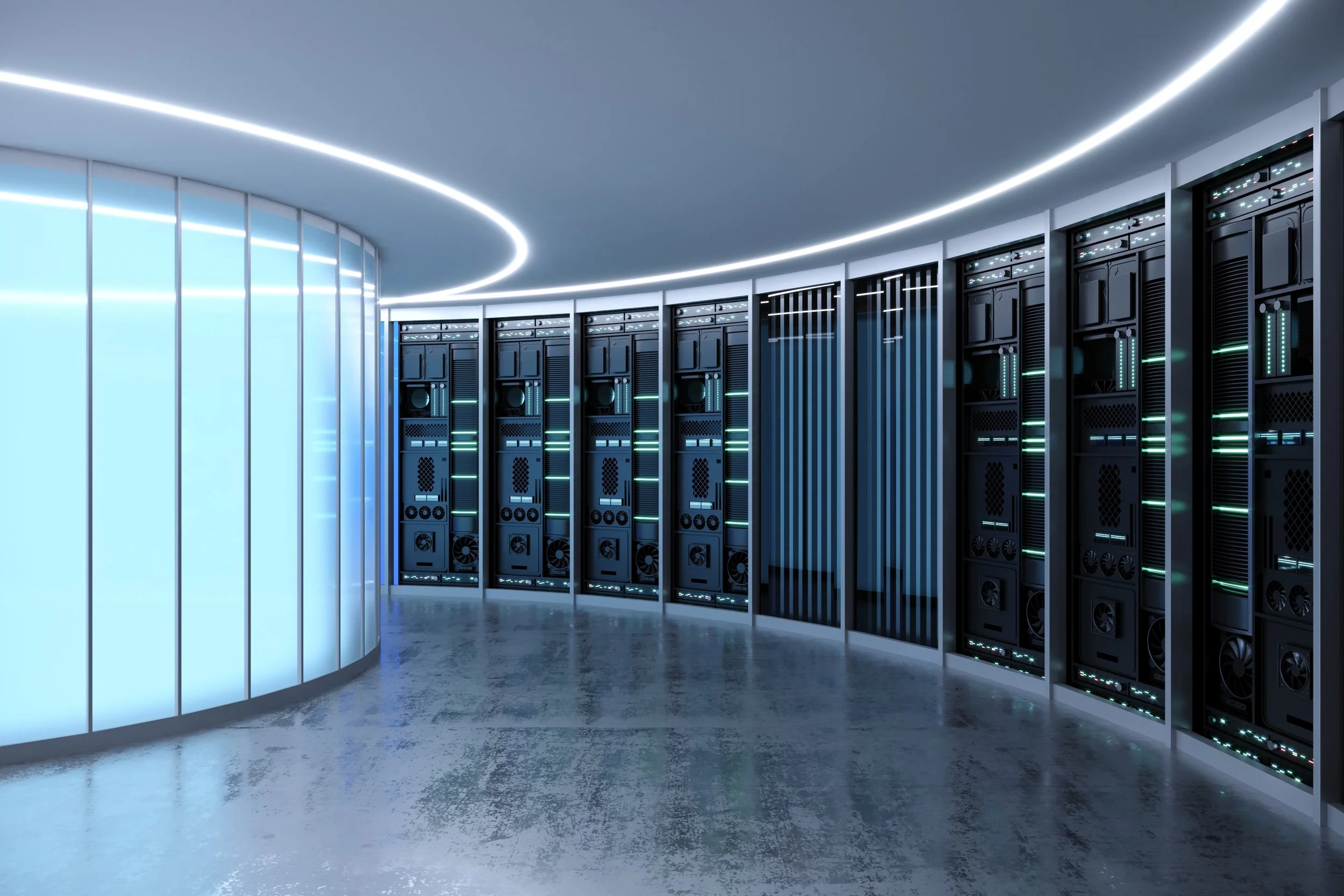 Interior of a modern data center with server racks and a curved, illuminated ceiling.