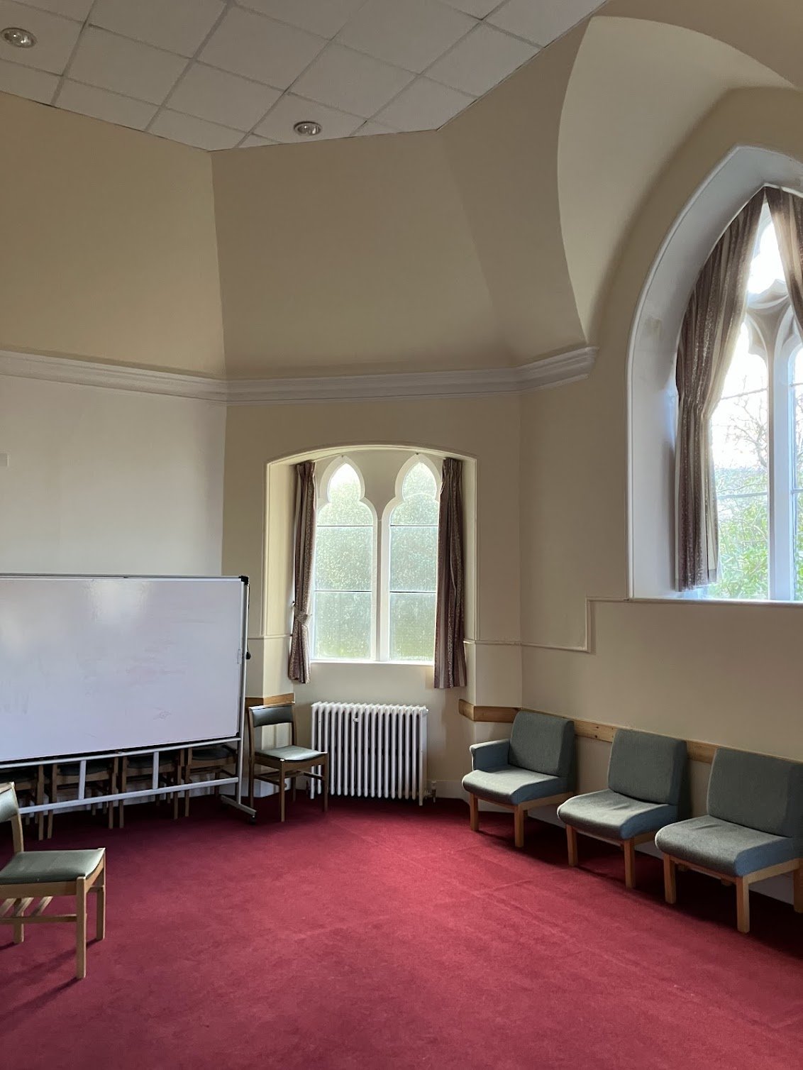 Hire the Chalmers Rooms at St Caths. A carpeted, welcoming space suited to informal gatherings, music sessions, and community meetings.