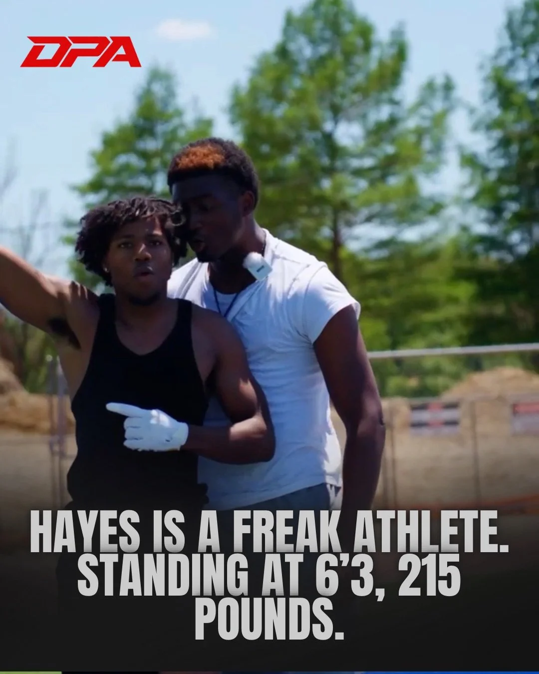 A young man and woman appear to be participating in a track and field event outdoors, with trees and a race track in the background. The woman is wearing a black athletic tank top and gloves, and the man is in a white athletic shirt with a headset around his neck. There is a red logo "DPA" in the top left corner, and bold text at the bottom states, "HAYES IS A FREAK ATHLETE. STANDING AT 6'3, 215 POUNDS."