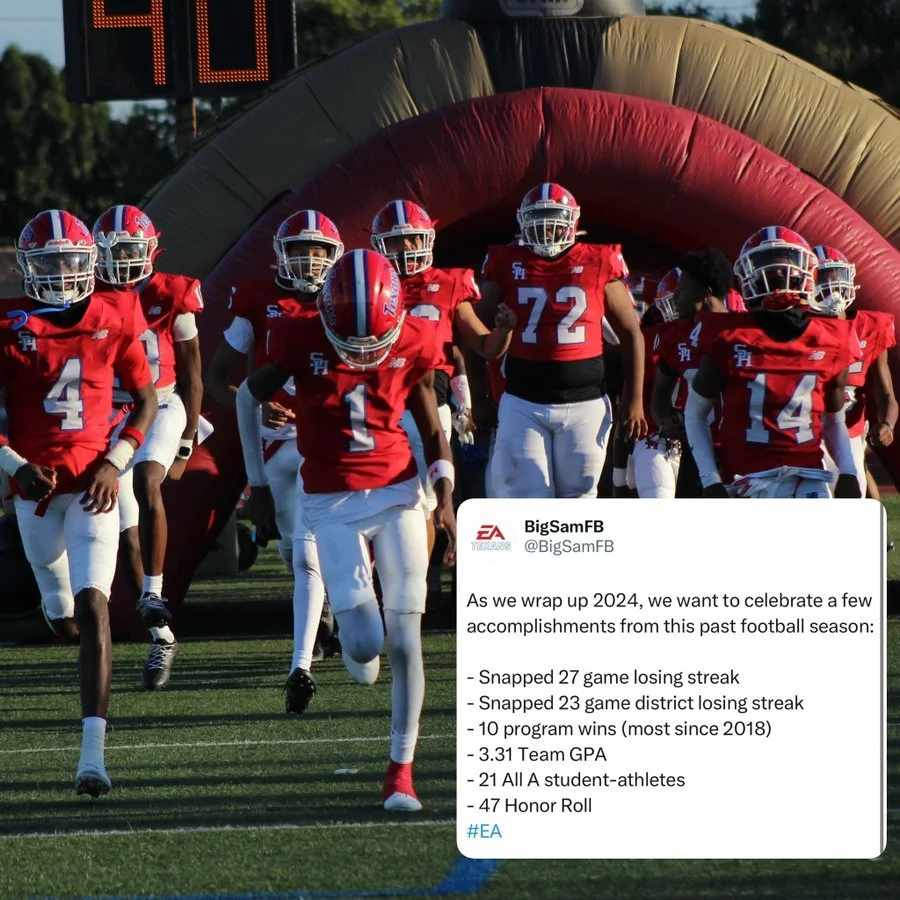 High school football team in red uniforms running onto the field from a tunnel with a digital scoreboard in the background, celebrating the end of a football season.