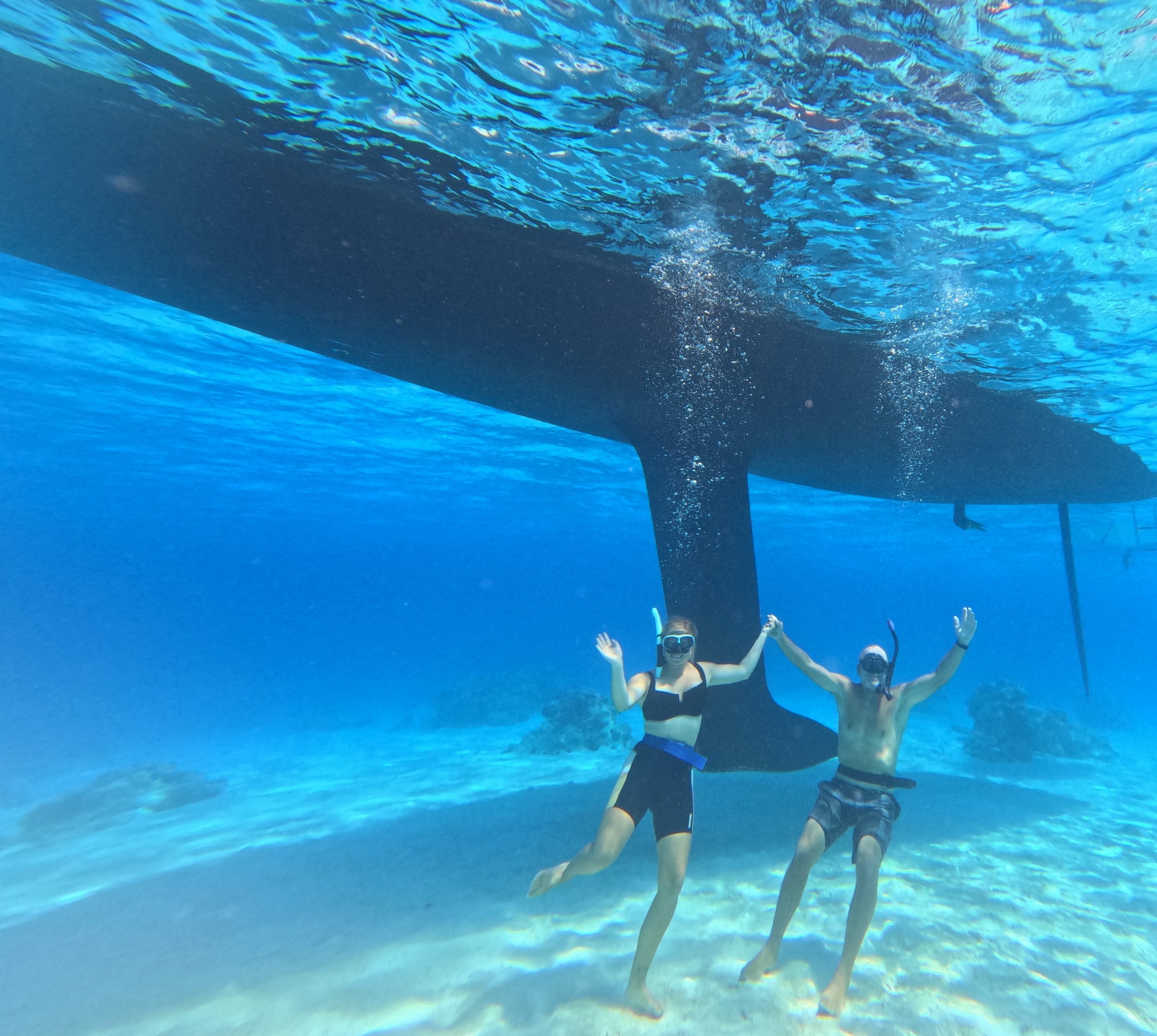 Dani and Dad under boat.jpg