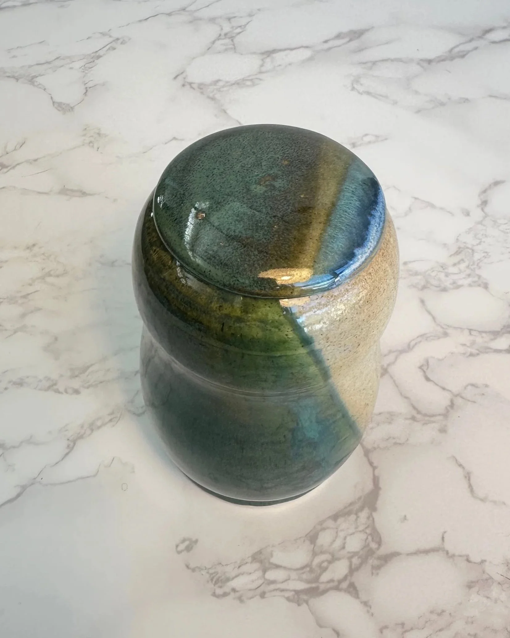 Top view of handmade ceramic penguin vessel showing glaze variation and textures by Tabula Rasa Clay.