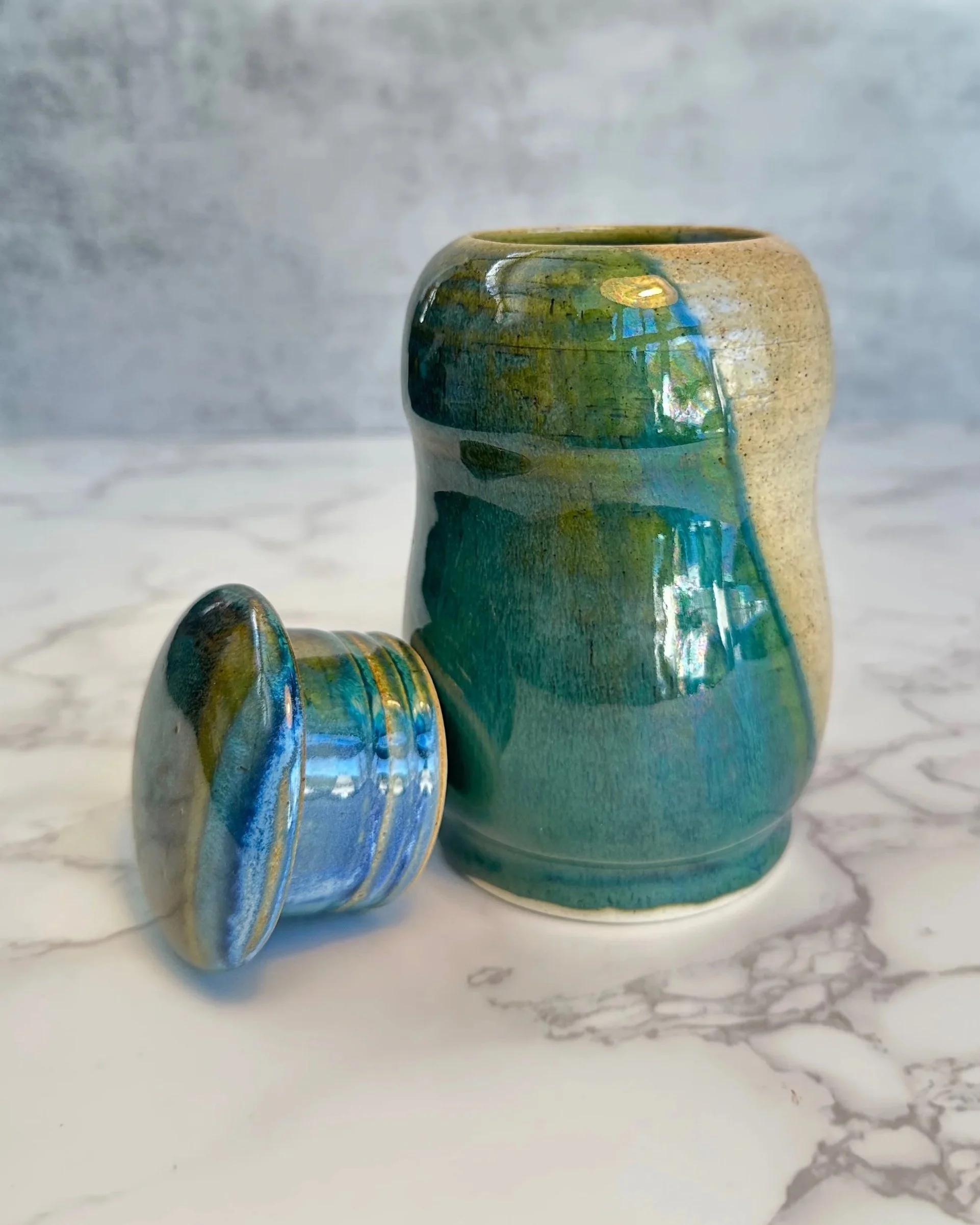 One-of-a-kind ceramic penguin form with sculptural curves and glossy glaze.