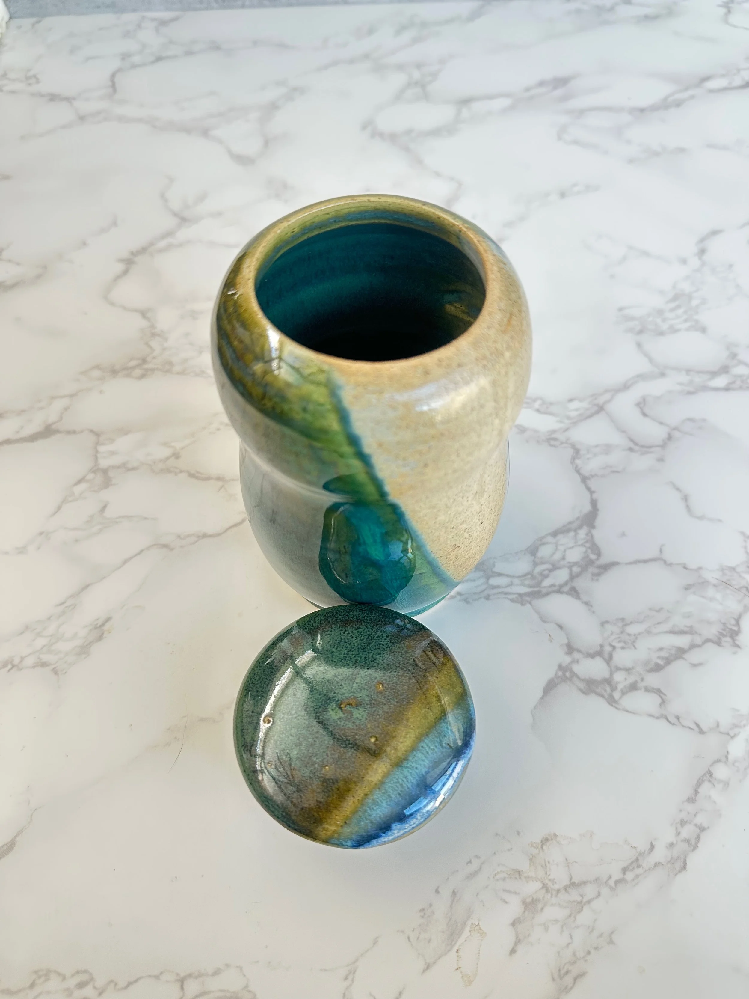 Top view of handmade ceramic penguin vessel showing glaze variation and textures by Tabula Rasa Clay.