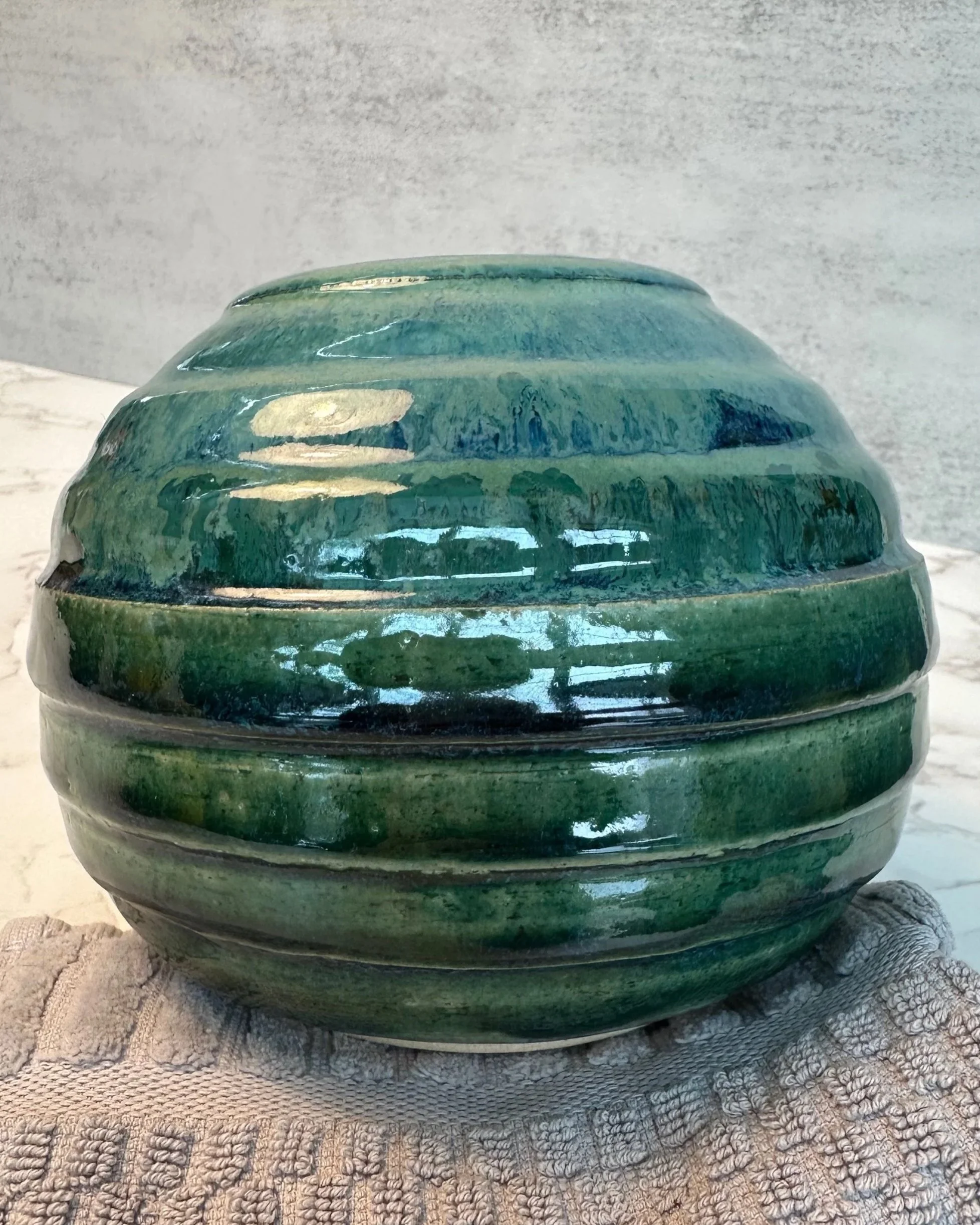 Handmade ceramic vase in ocean blue and green striated glaze