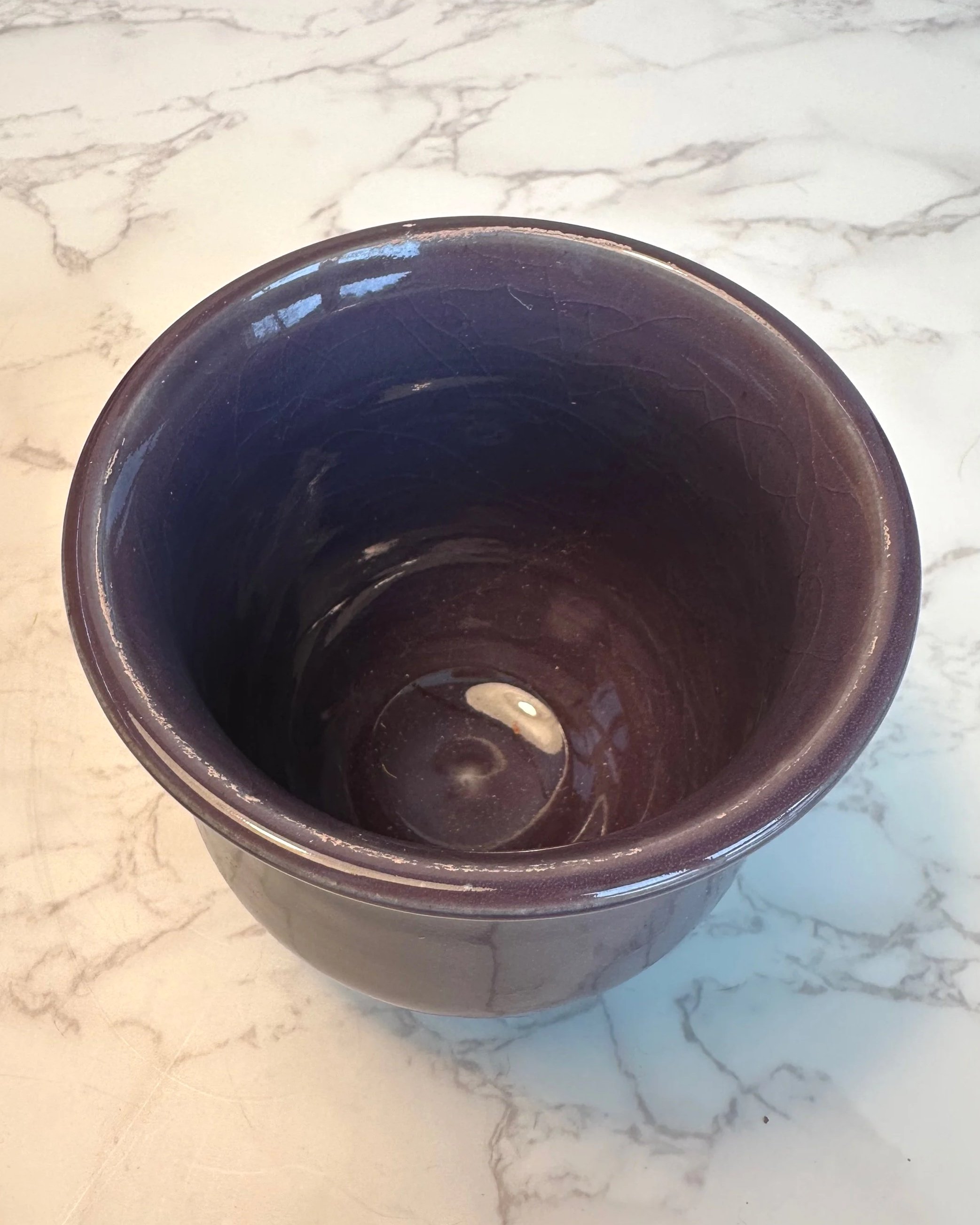 Top view of handmade stoneware planter in deep plum glaze