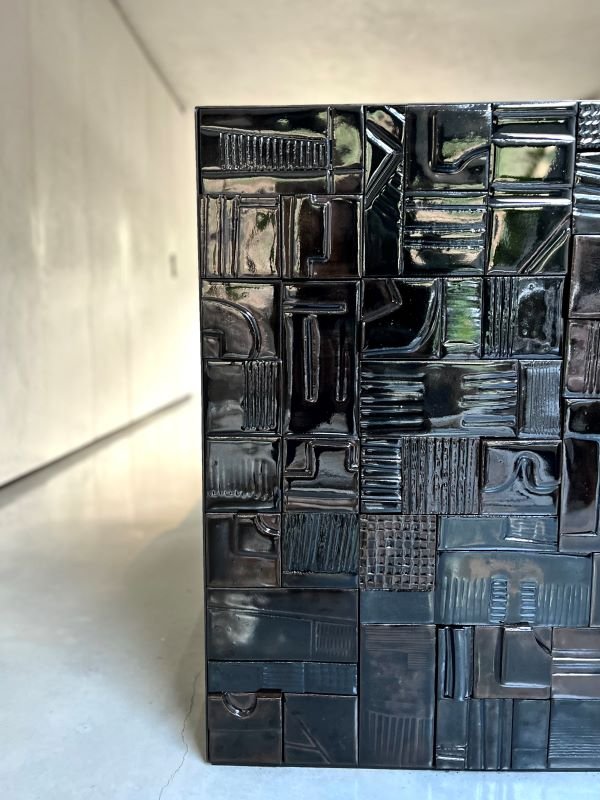 Black glossy glazed ceramic tiles with various geometric patterns