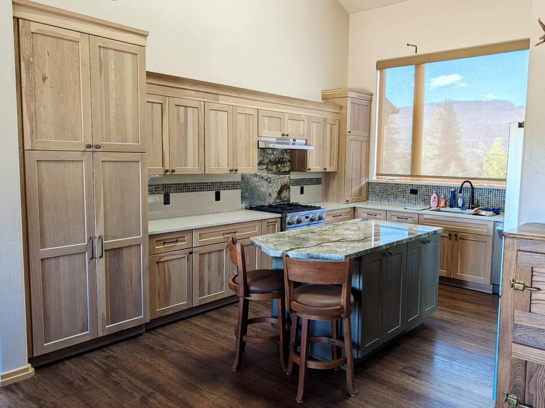 White Oak Kitchen Cabinets. Functional design to hide hood ducting and to provide lots of storage.