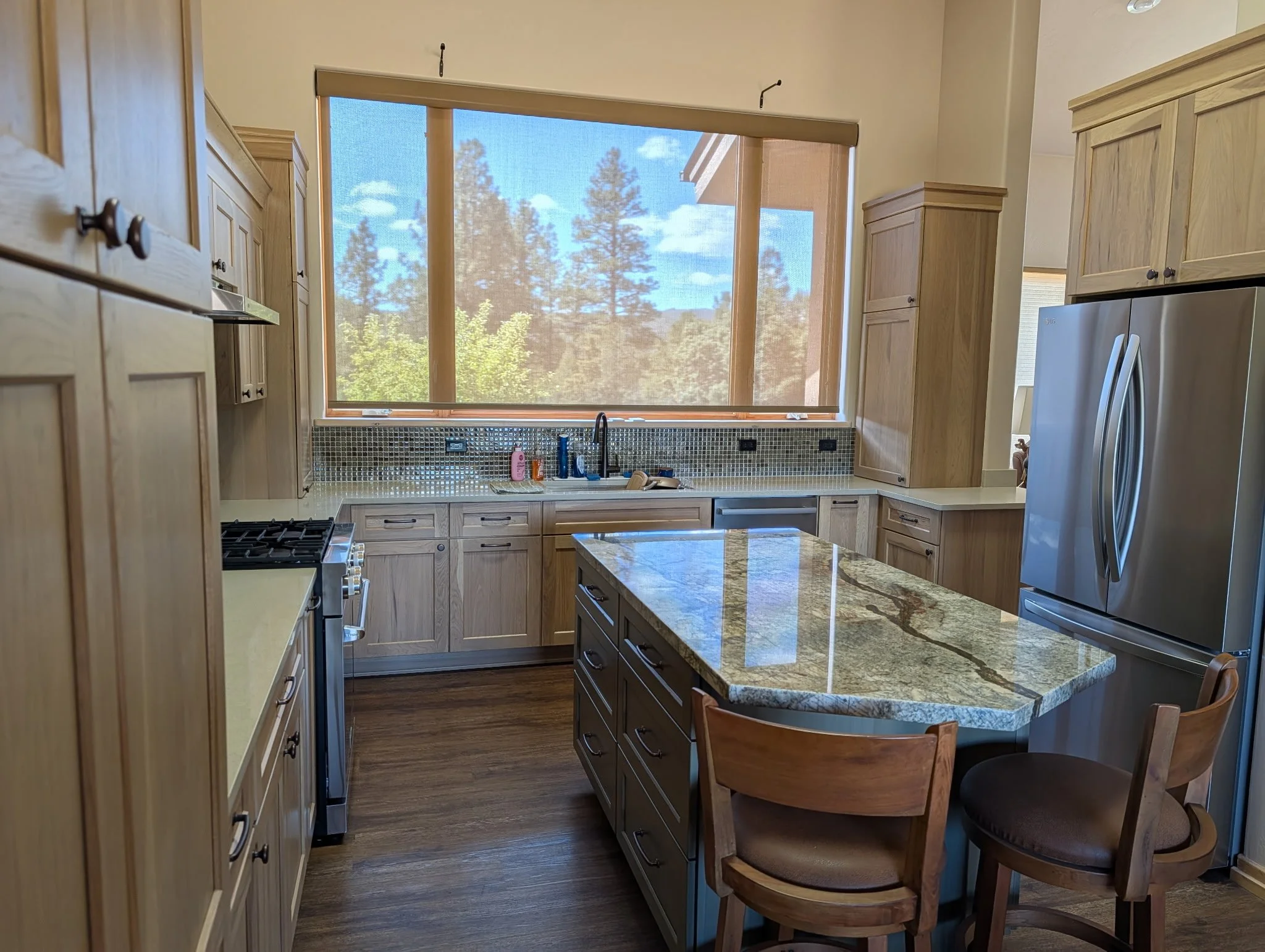Unique island shape from semi-custom cabinetry to fit a unique kitchen space.