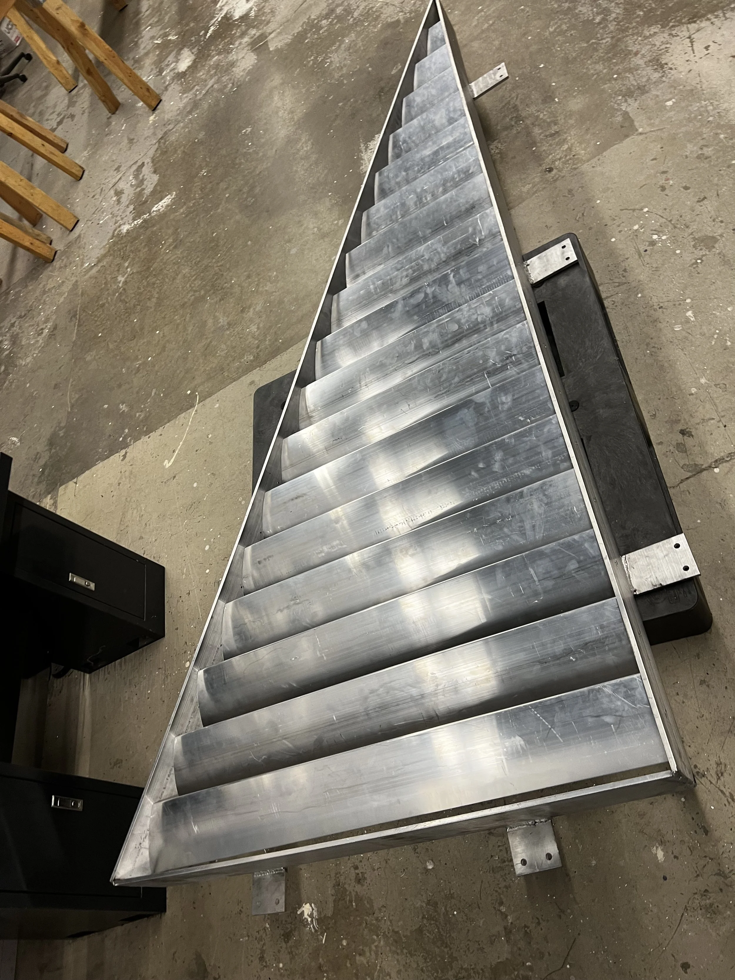 Top of the triangular aluminum sunshade panel in production, fabricated by Leif Armstrong for the Burlington Community Centre