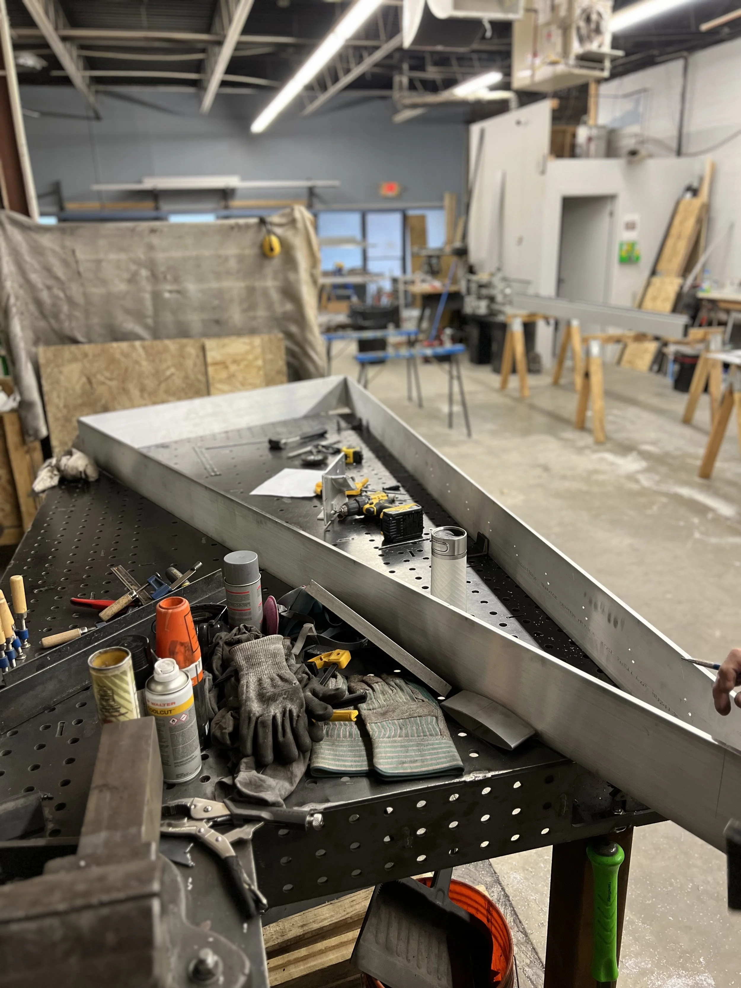 Triangular aluminum sunshade panel in production, fabricated by Leif Armstrong for the Burlington Community Centre