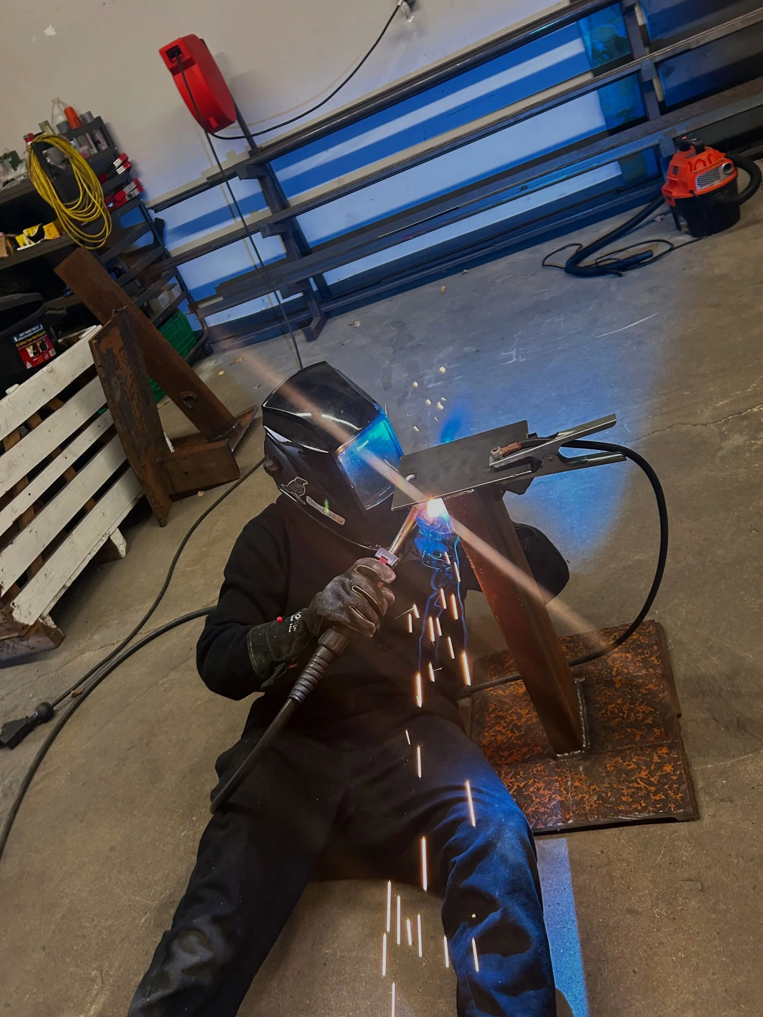 Fabricator Leif Armstrong welding a custom steel project in the Armstrong Fabrication workshop in London, Ontario