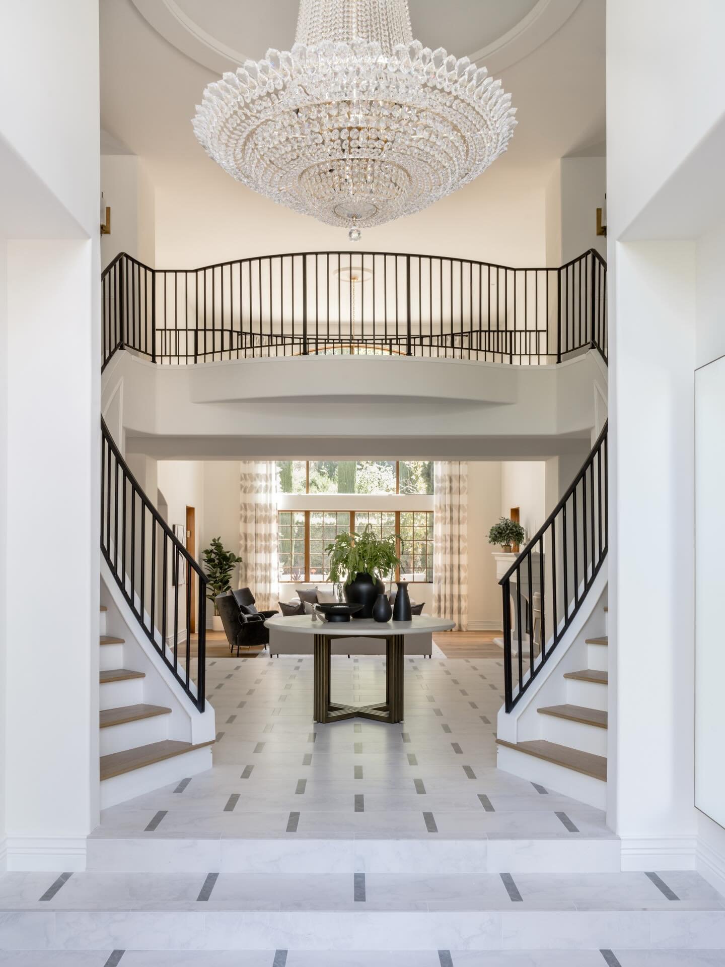 This 7,500-square-foot modern Mediterranean home offered abundant space but initially lacked a sense of scale and intimacy. After relocating from a London flat, the family needed furnishings that could ground the home and bring proportion, warmth, an