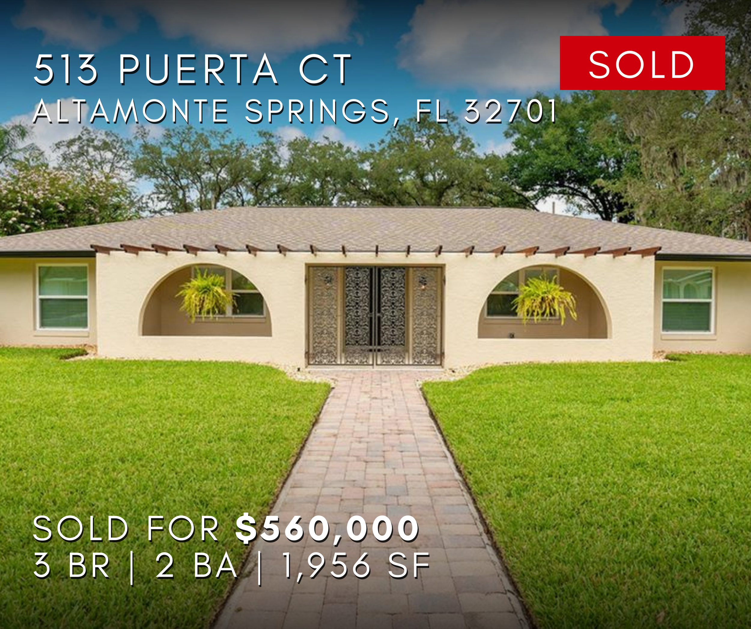 Front view of a single-story house with a brick pathway leading to the front door, green lawn on both sides, decorative window arches, and hanging plants. The house has a sign indicating it was sold for $560,000, located at 513 Puerta Ct, Altamonte S