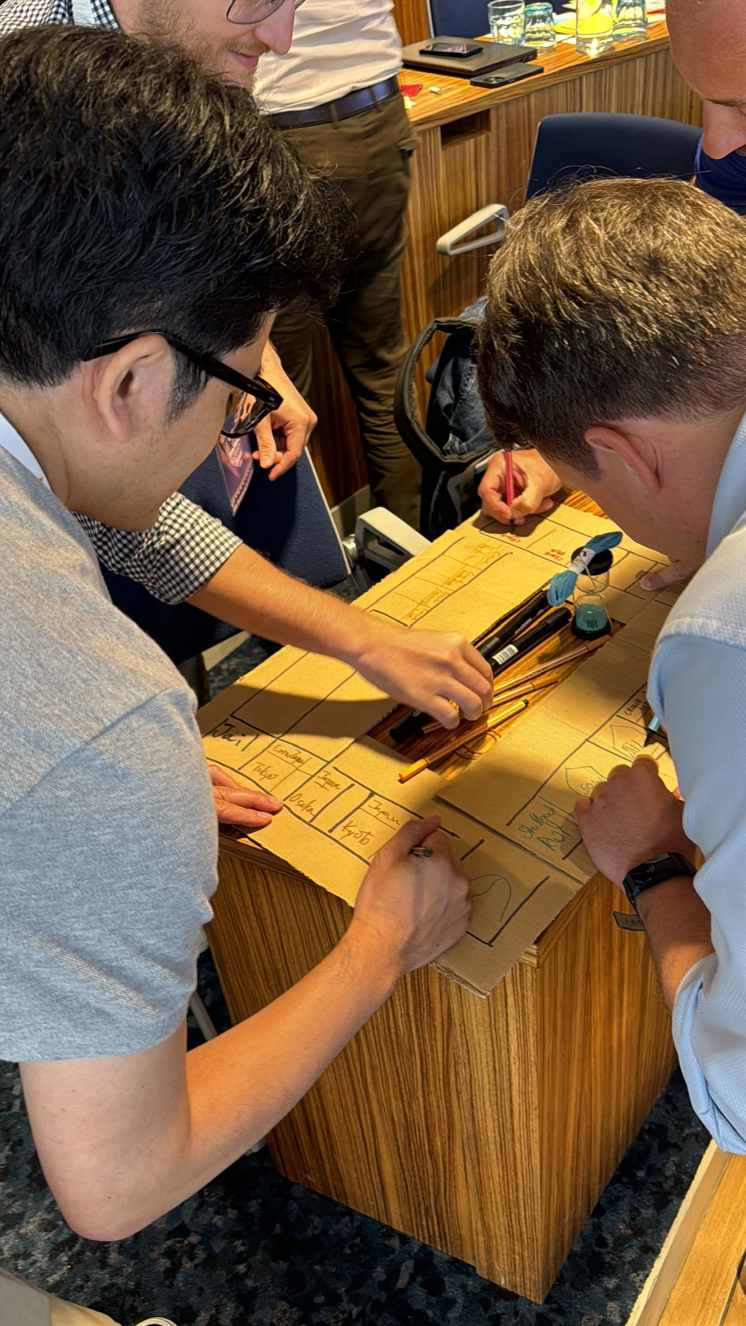 18 Coffees training participants collaborating on an interactive group project.
