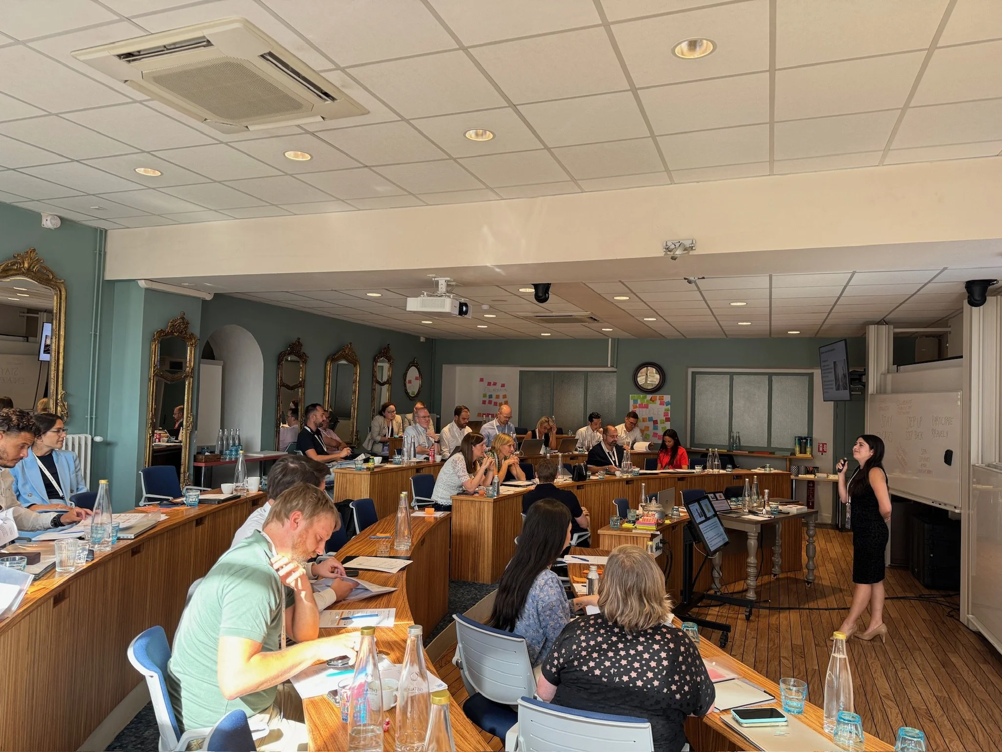 18 Coffees training in stadium-style classroom.