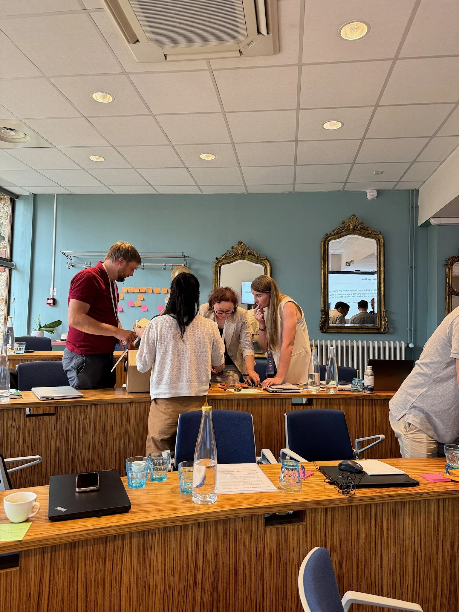 18 Coffees training participants collaborating on a hands-on project during training.