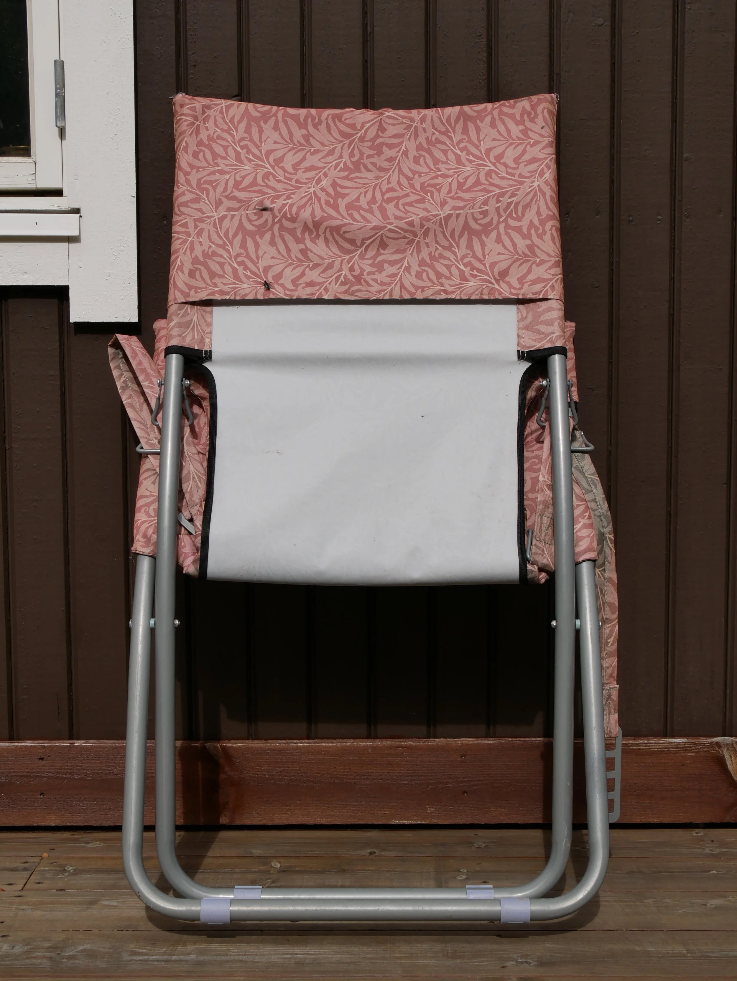 folded chair and fly - 2026 - Digital photograph