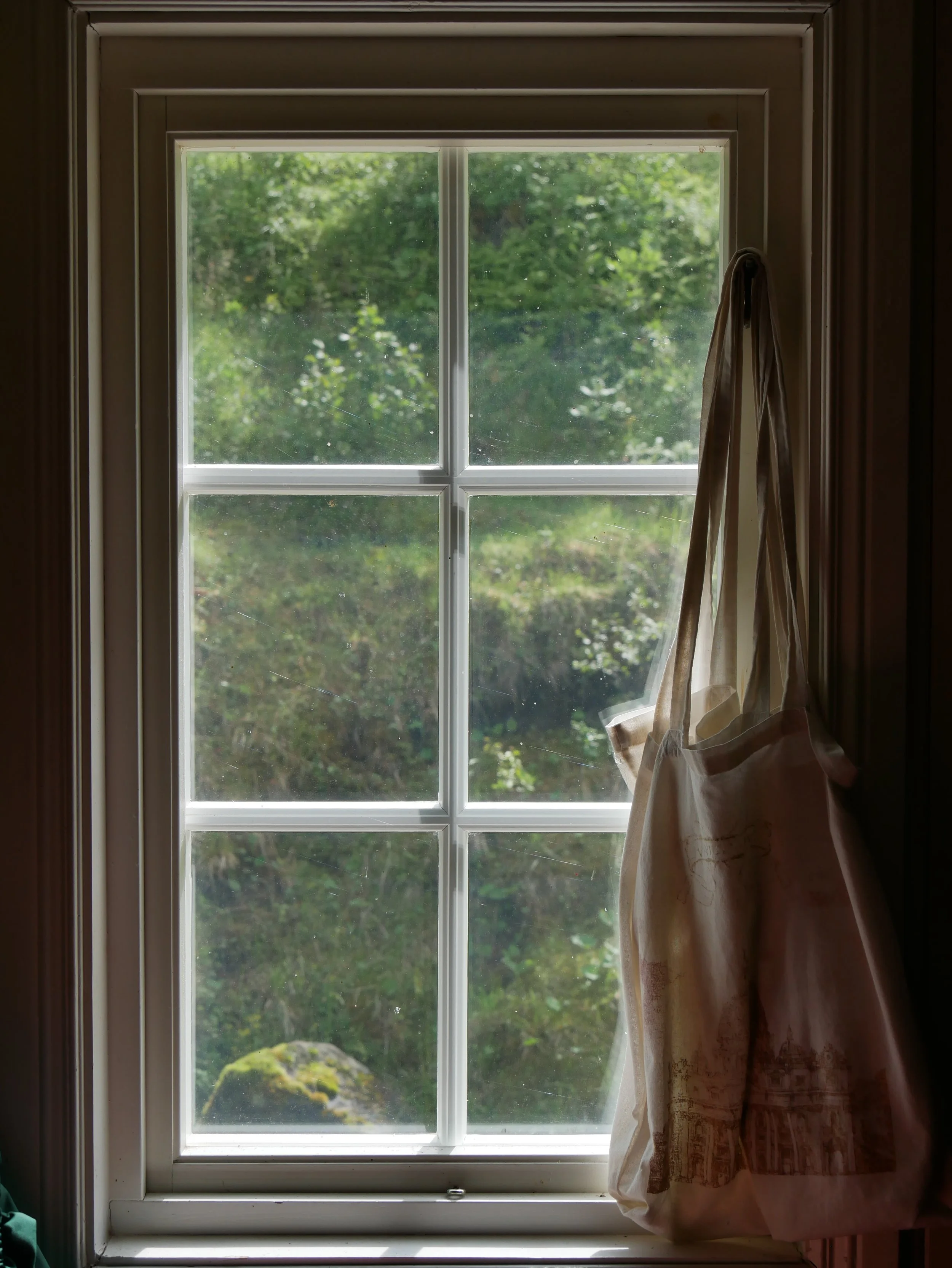 a bag hanging by the window - 2026 - Digital photograph