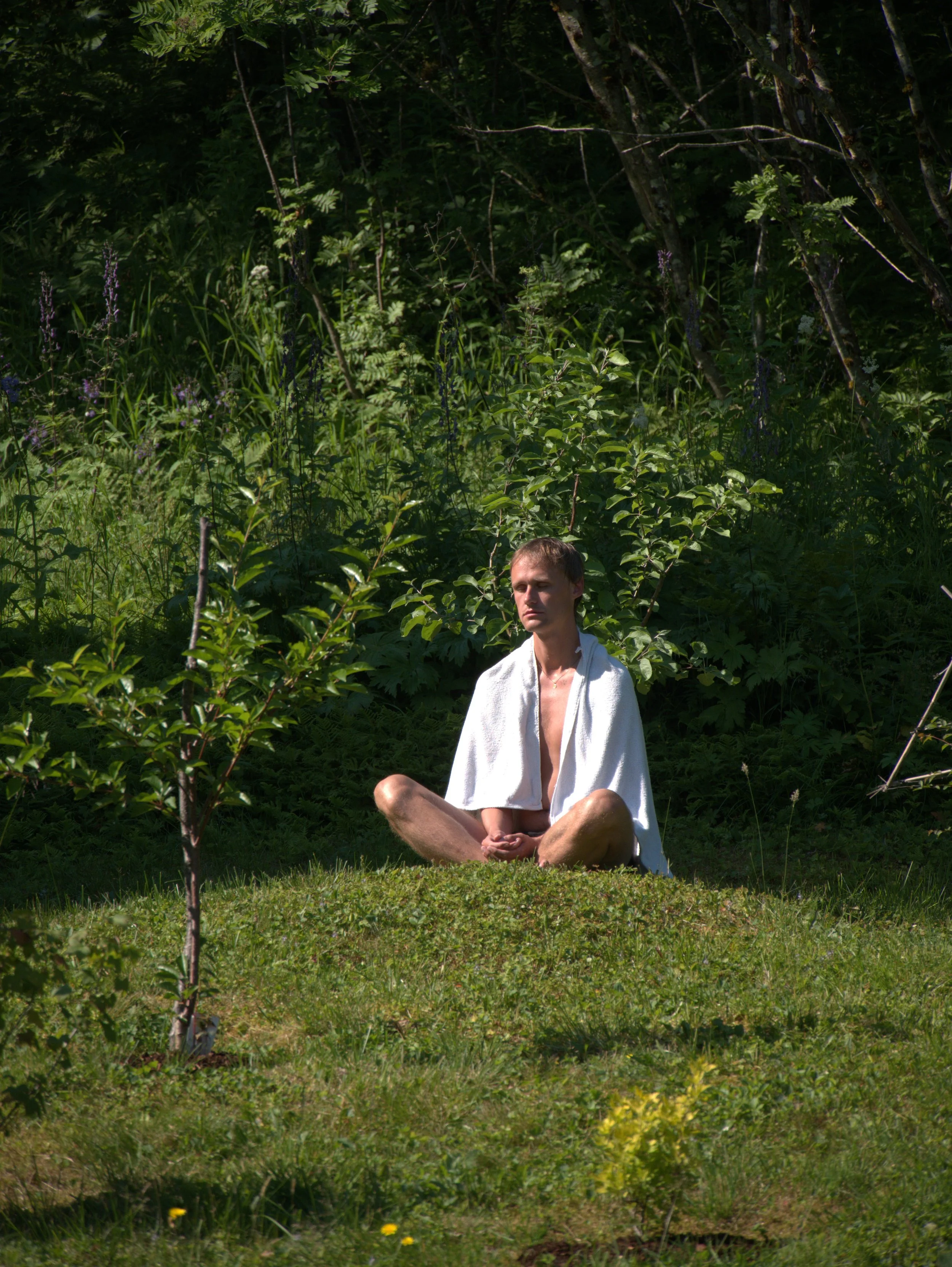 Joakim meditates on the hill, protects himself from the bugs - 2025 - Digital photograph