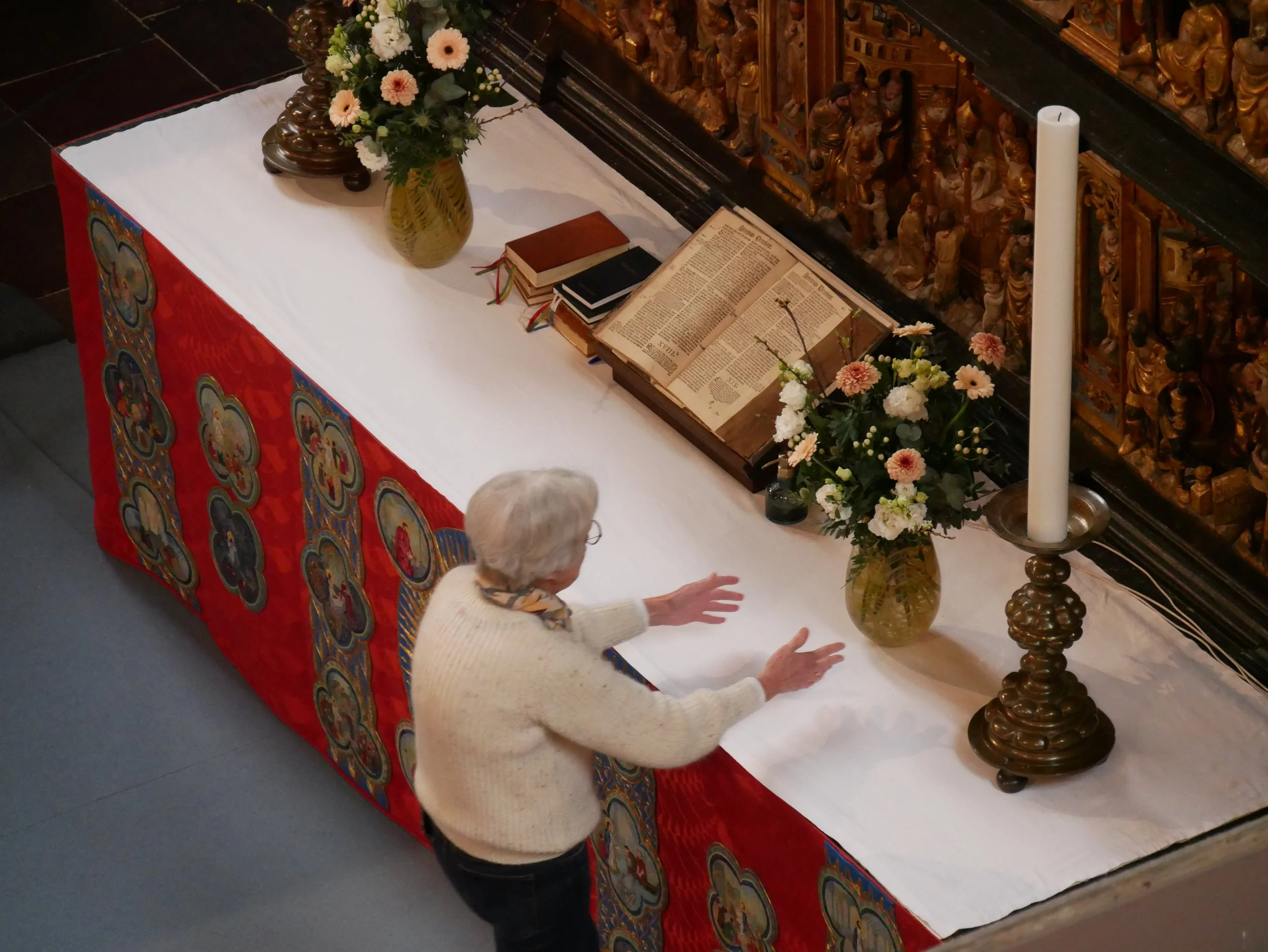 lady arranging the altar - 2025 - Digital photograph
