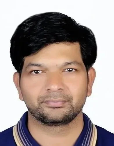 Close-up of Santosh Nikam, MS, Quality Consultant at Streamline BioOps, wearing a blue jacket with a striped collar against a white background.