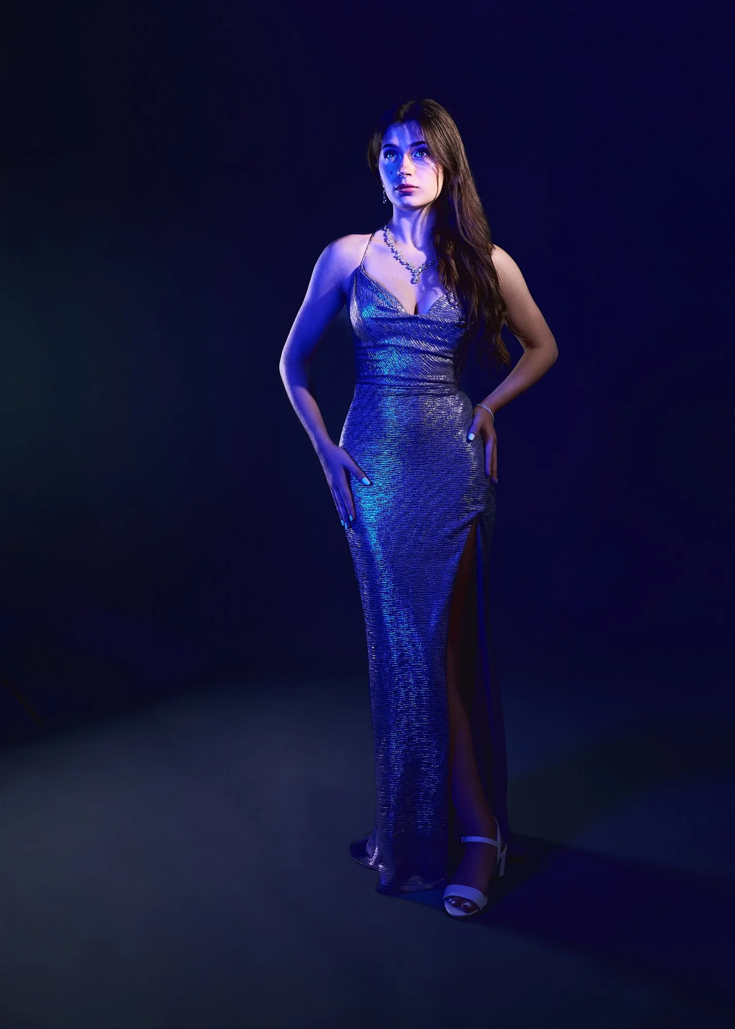studio-portrait-woman-blue-light-standing.jpg