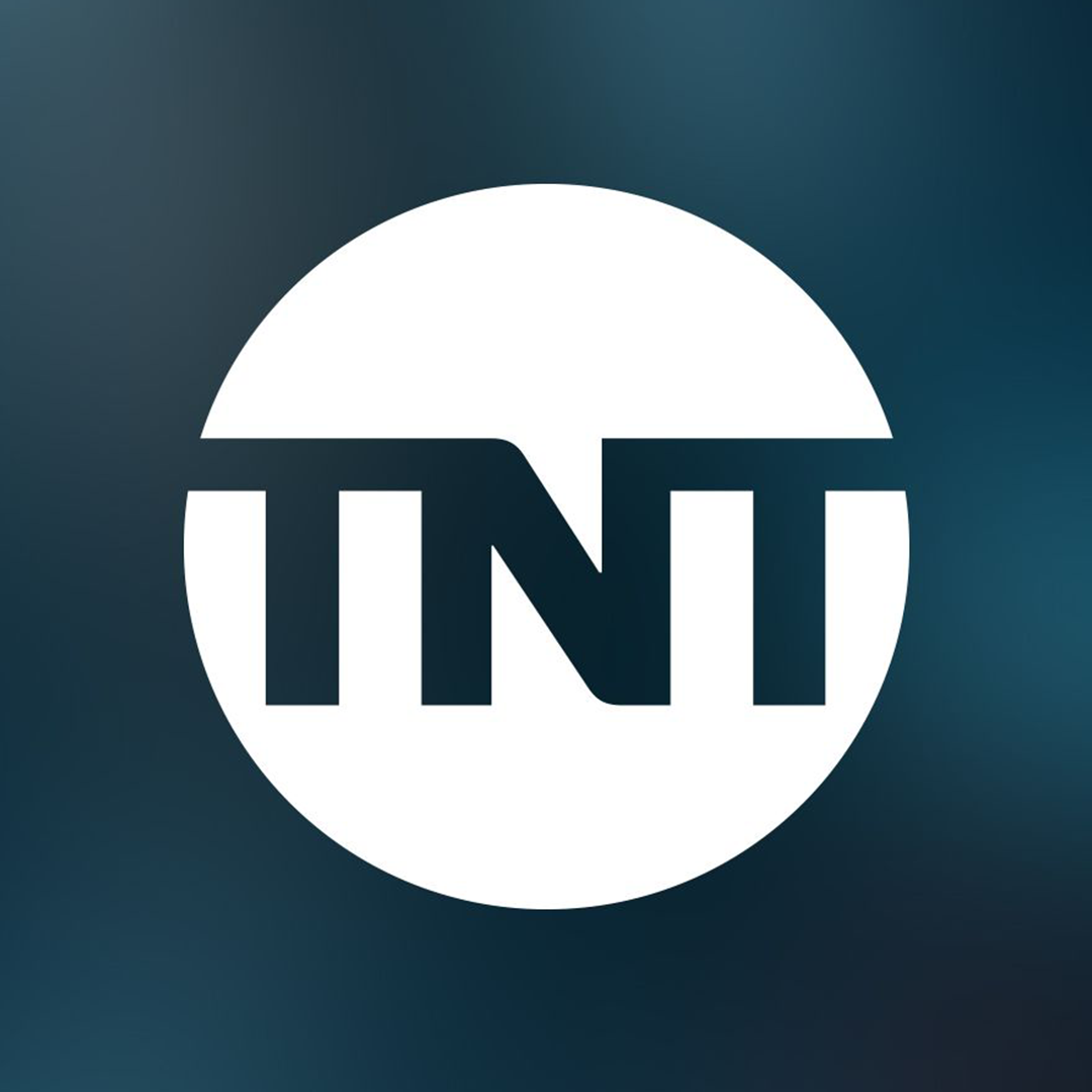 TNT logo with a white circle, black text, against a dark background.