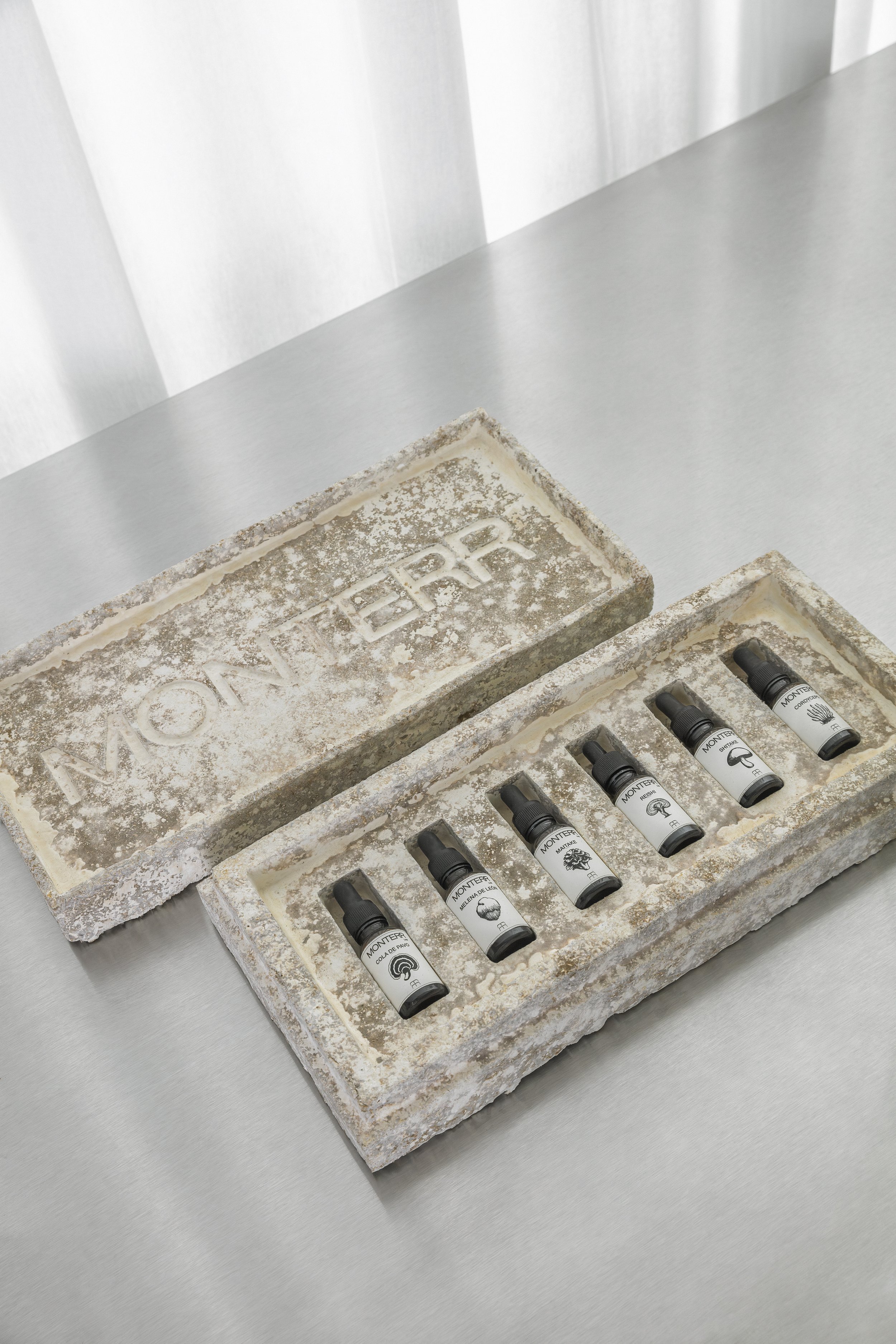 Custom compostable mycelium packaging designed for a set of medicinal mushroom tinctures.