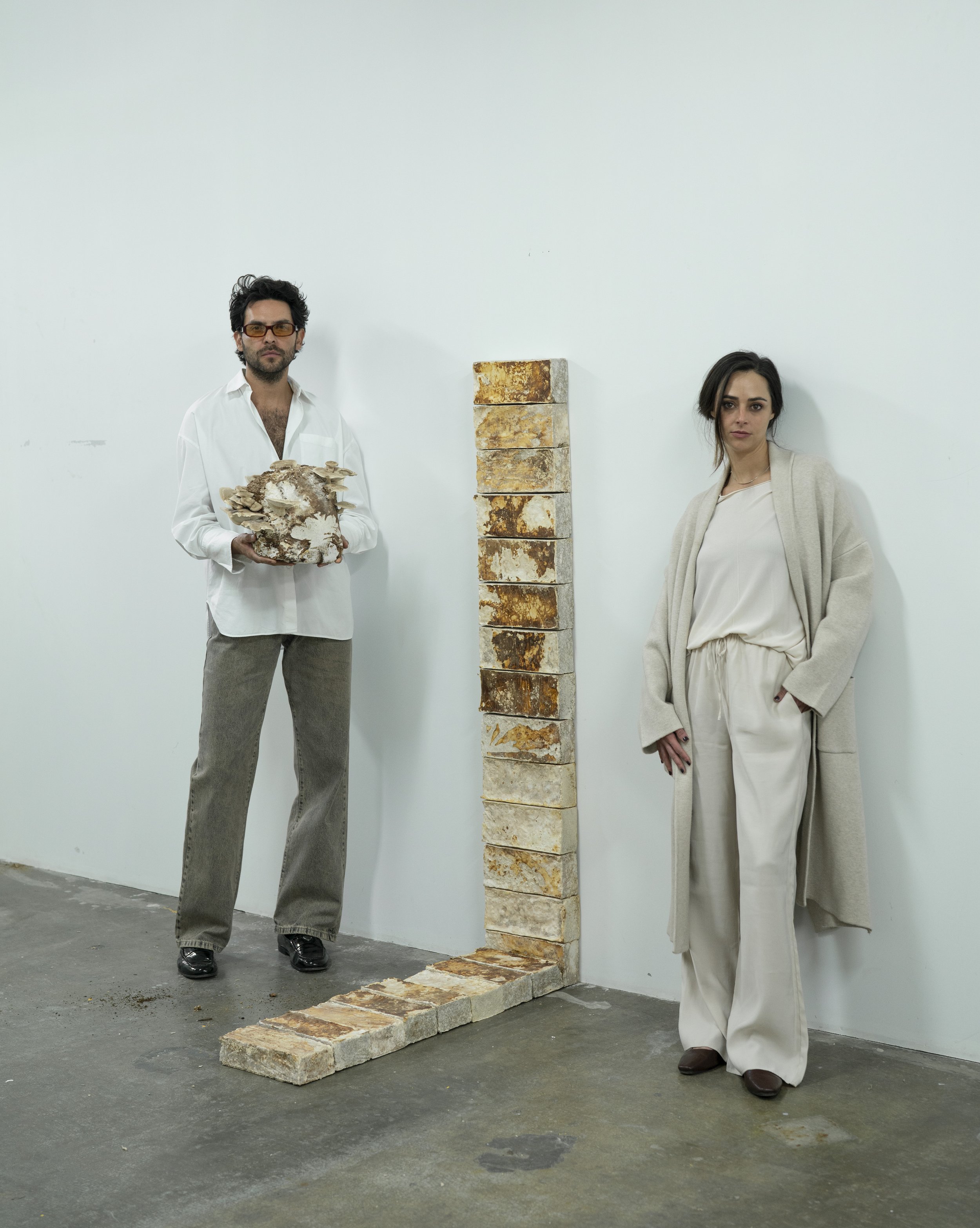 Monterr Lab founders Federico Herrera and María Monteys with a modular mycelium installation developed by Monterr Studio.