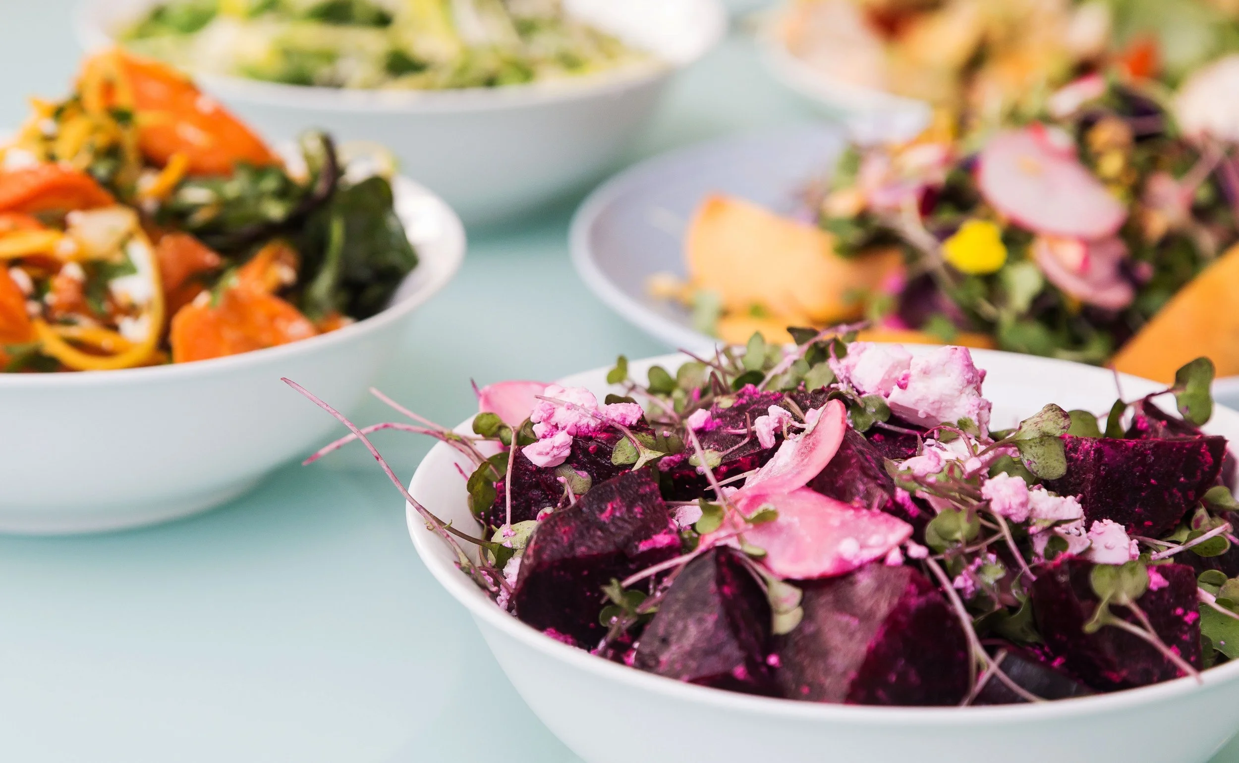Corporate catering spread with fresh salads and shared platters for an office lunch in Christchurch