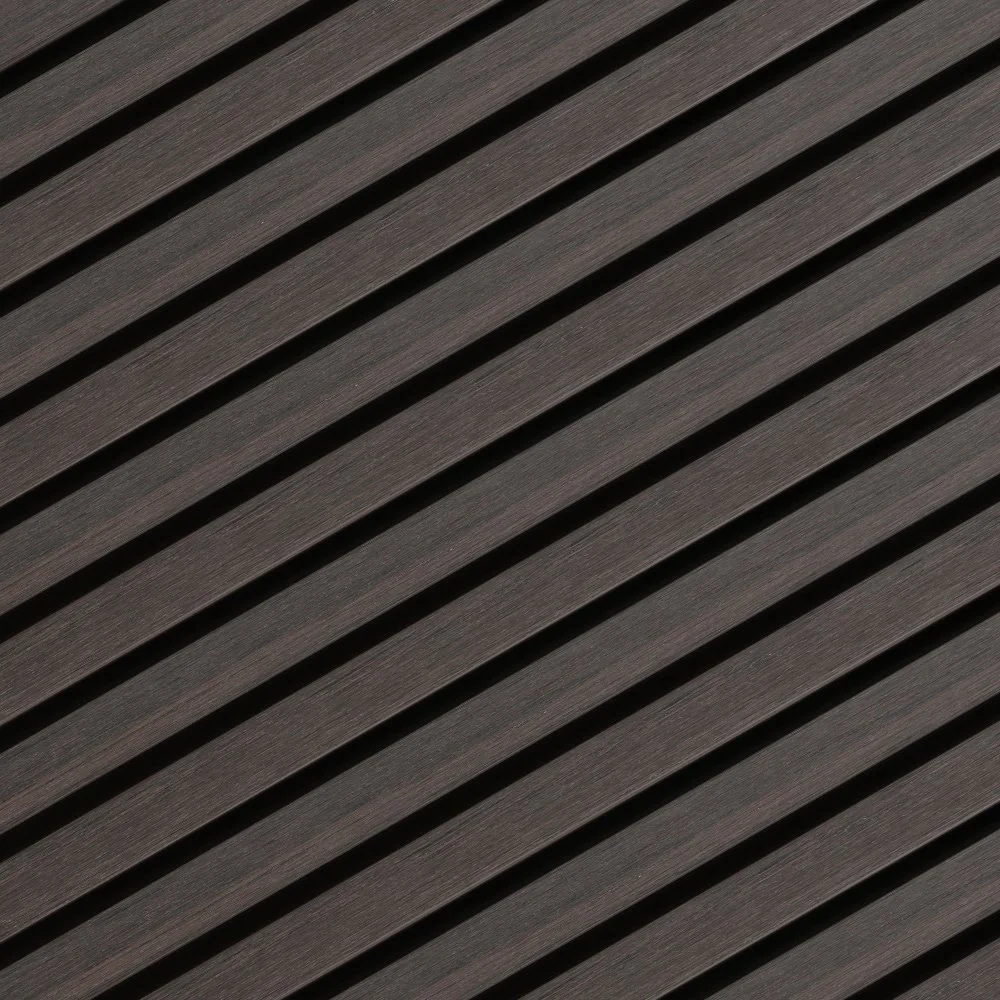 Close-up view of dark gray diagonal acoustic foam panels with ridges.