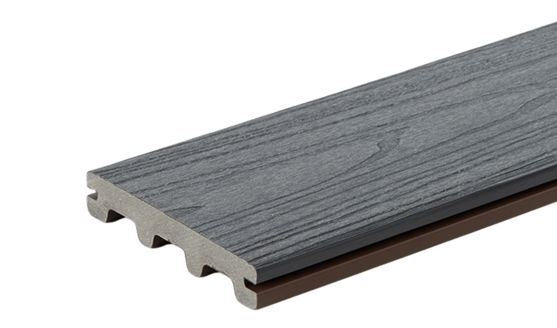 A close-up of a gray, wood-textured composite decking board with a dark brown underside and a plastic tongue-and-groove edge.