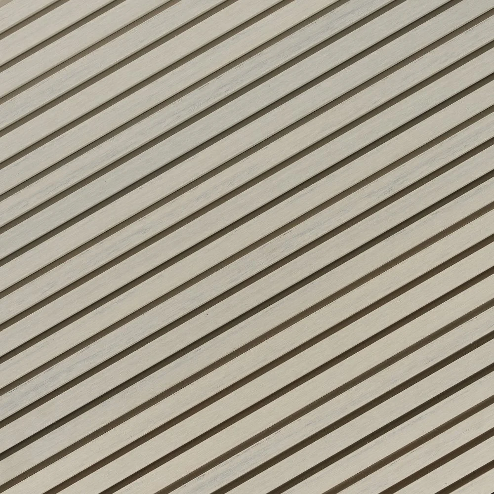 Close-up photo of a wooden deck with diagonal planks.