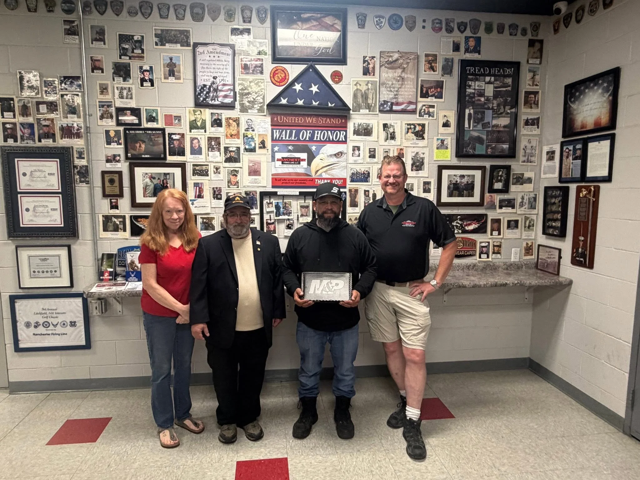 Manchester Republican Committee Fundraiser Chairman Paul LaFerriere and Assistant Melodye Smith presenting the winner of the raffled firearm with our sponsor Manchester Firing Line.