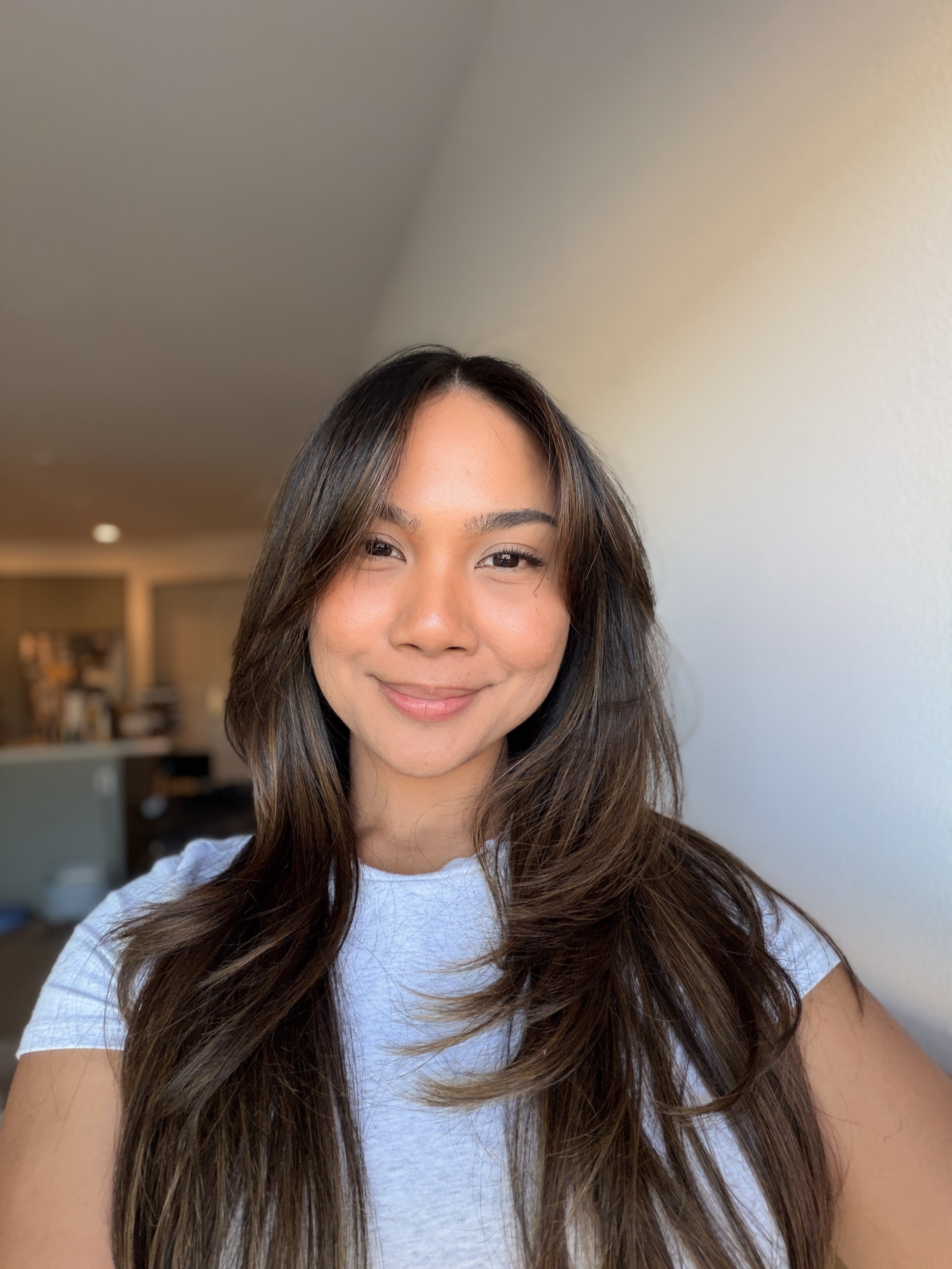Jenny Seradilla, LMFT, smiling in a indoor headshot.