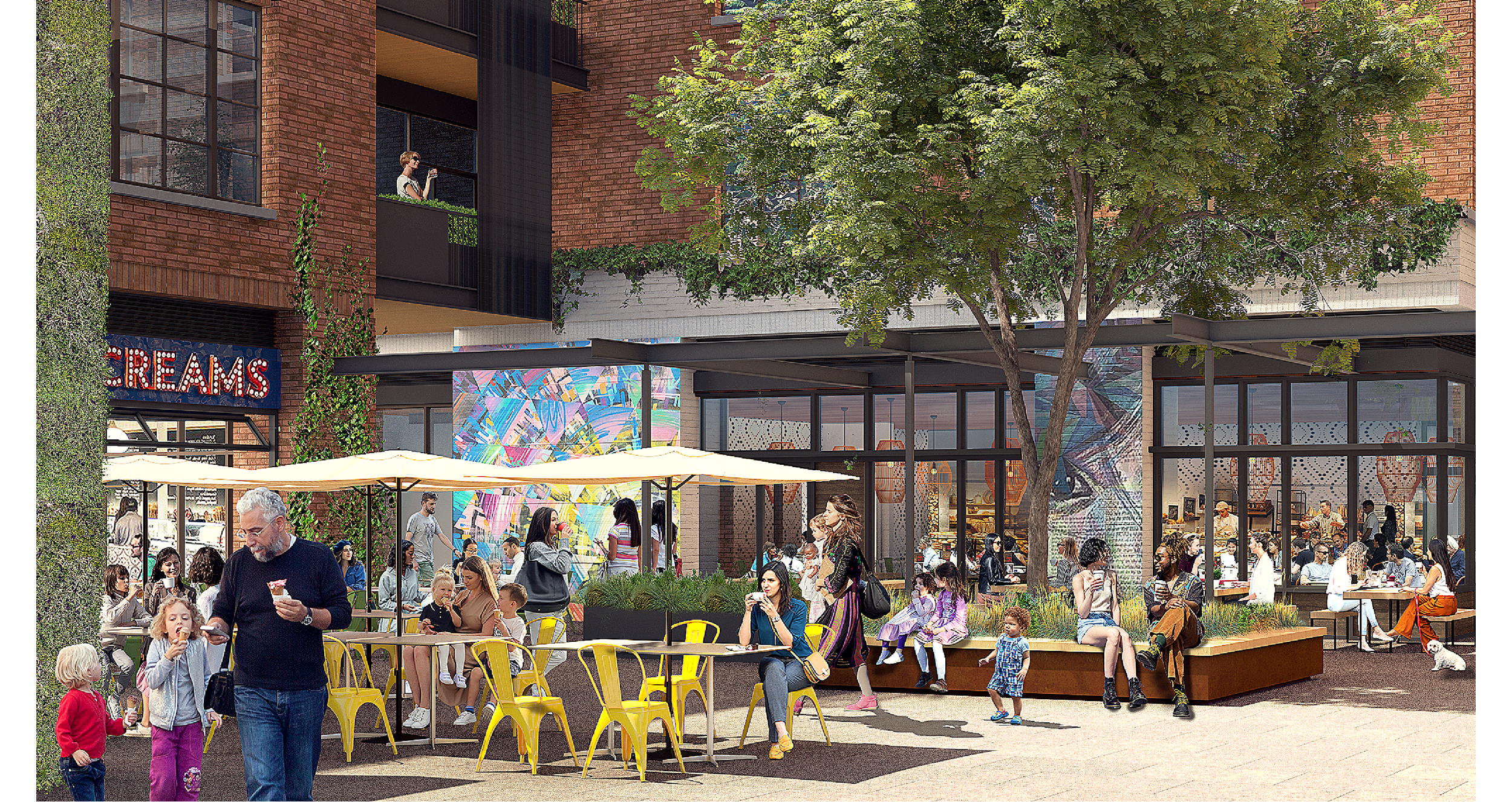 A lively outdoor scene at a modern urban plaza with people sitting, walking, and socializing. There are yellow tables and chairs, umbrellas, large trees, a brick building with large windows, and decorative urban art. A woman is on a balcony taking a photo, and a sign reading 'DREAMS' is visible. Some children and adults are eating, talking, and enjoying the day.